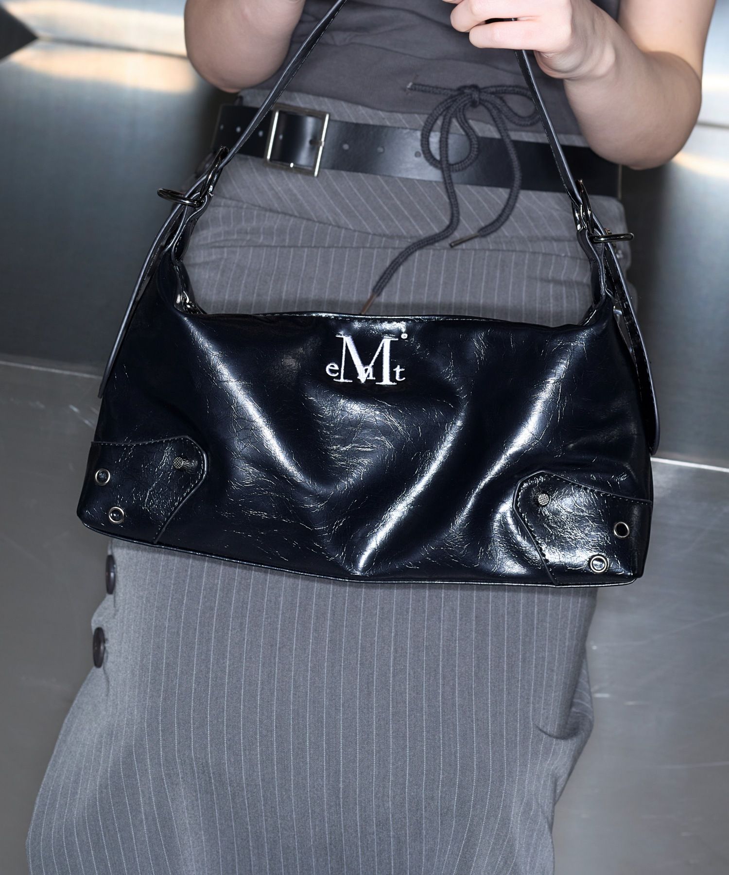 MUSINSA | MUCENT North Eyelet Leather Shoulder Bag Unisex