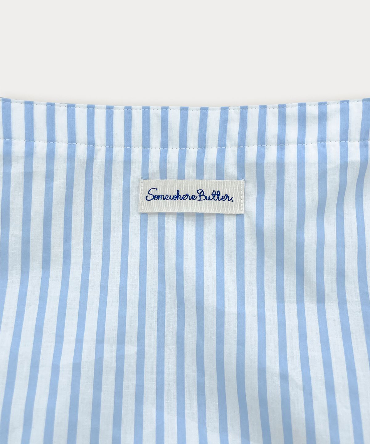 썸웨어버터(SOMEWHEREBUTTER) Letter Reversible Bag - Ivory