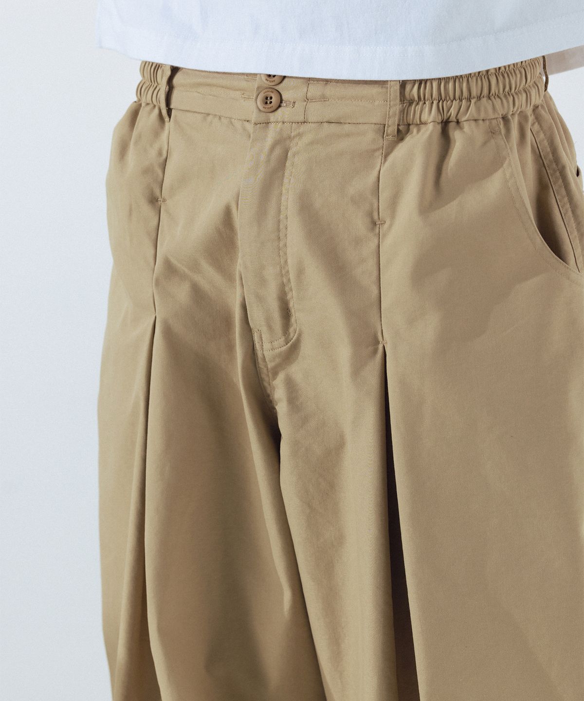 앵글런(ANGLAN) Unbalance Long Tuck Balloon Pants - Beige