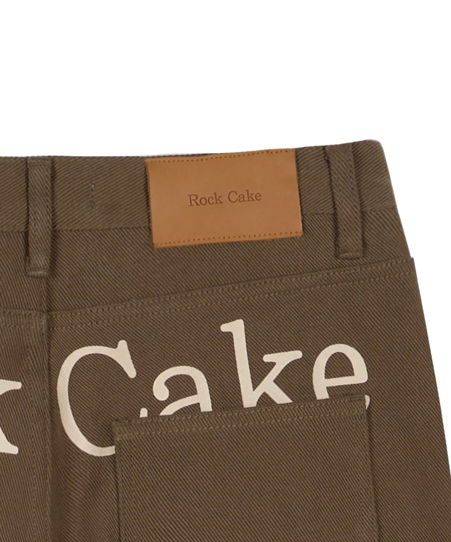 MUSINSA | ROCKCAKE Lettering Hide Pants - Brown