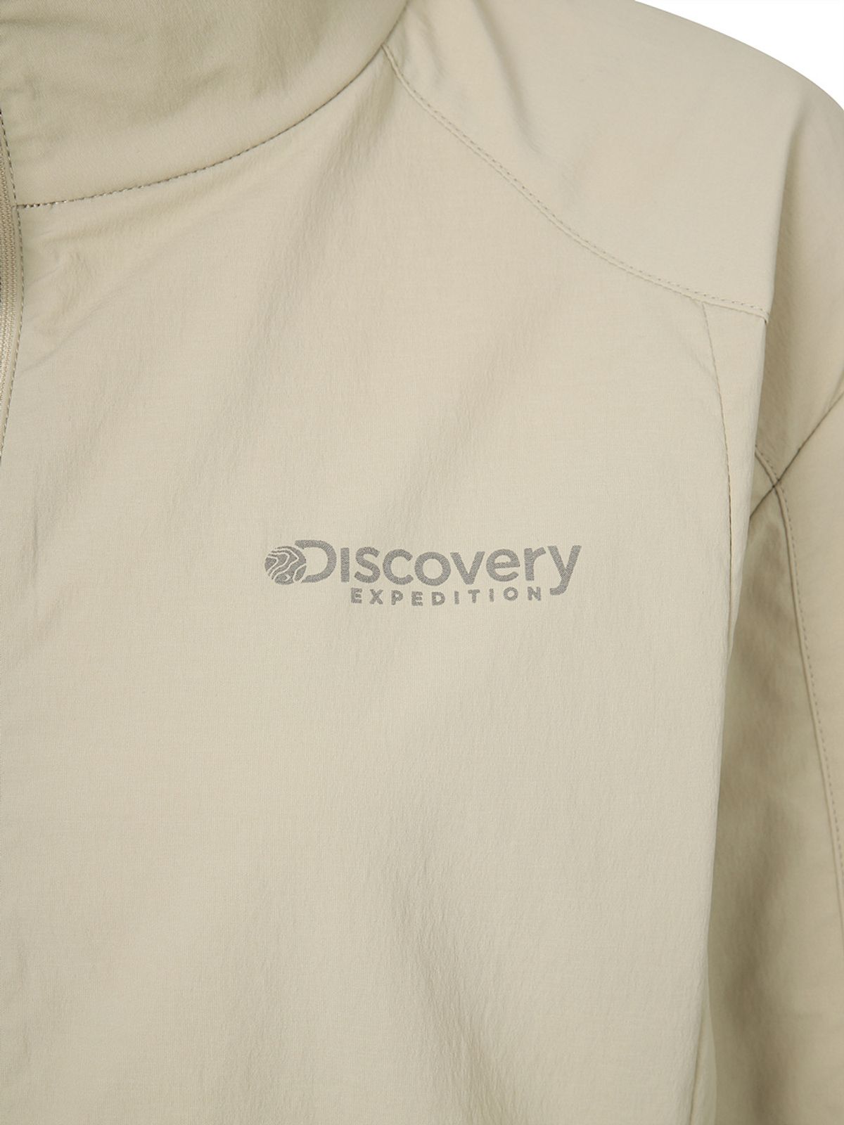 디스커버리 익스페디션(DISCOVERY EXPEDITION) 프레시벤트 여성 폴튼 경량 세미오버핏 트레이닝 자켓 (L/BEIGE)