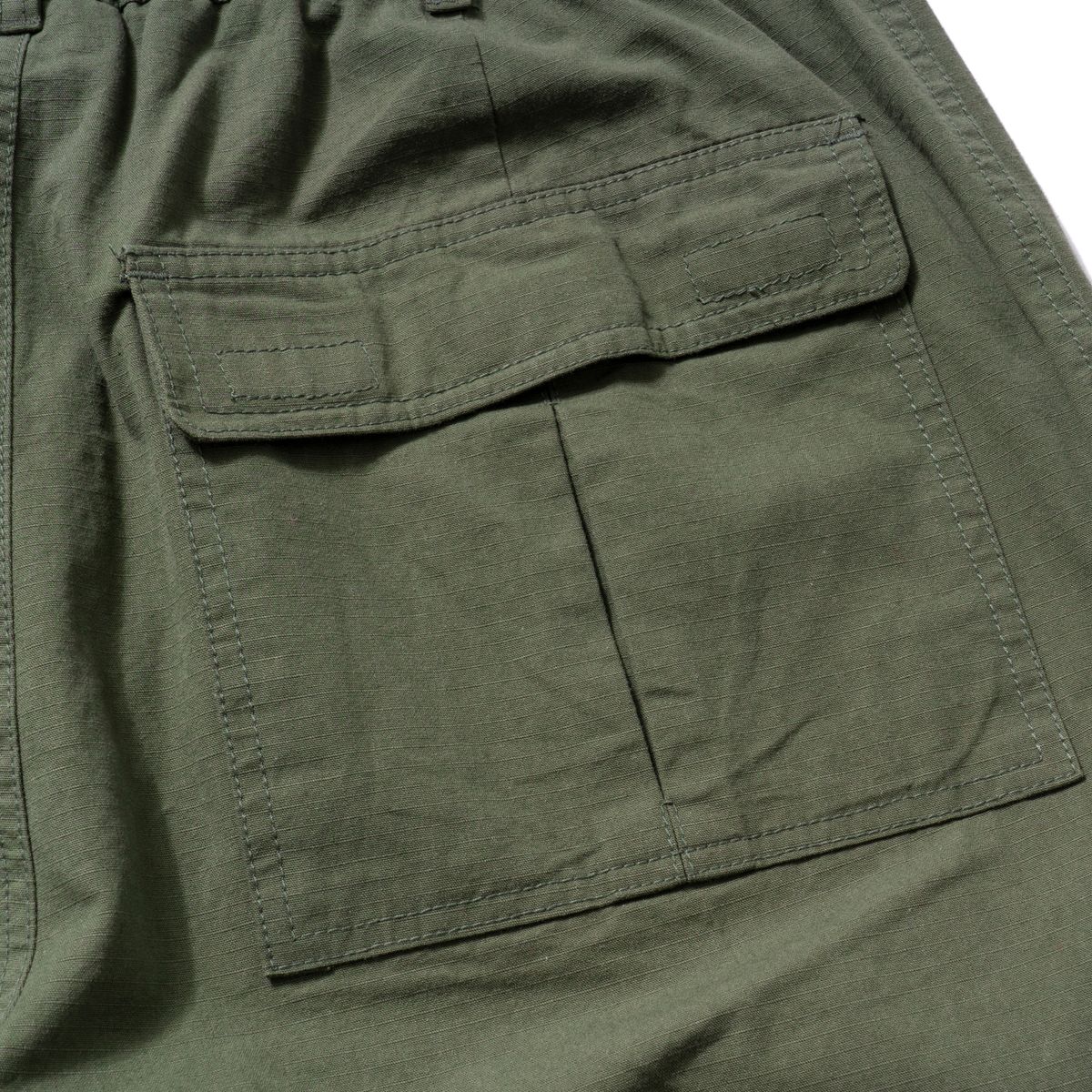엑스트라오디너리(EXTRAORDINARY) RIPSTOP FATIGUE BENDING PANTS KHAKI