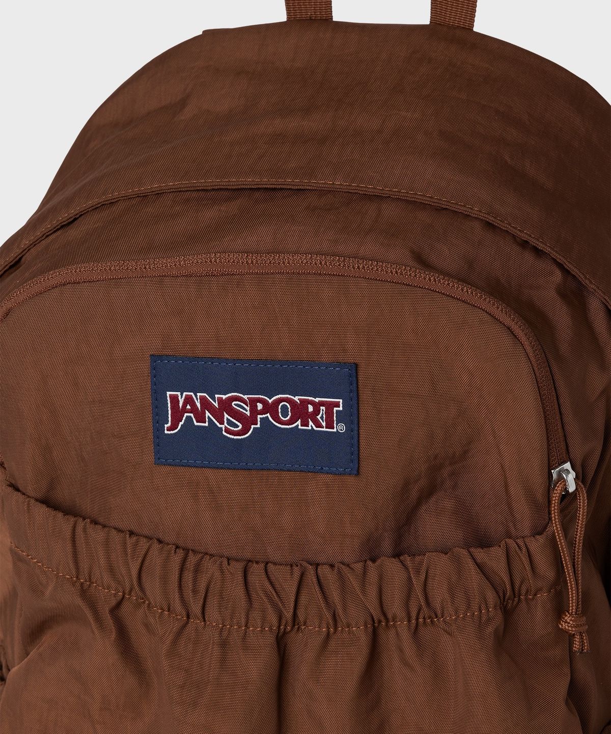 잔스포츠(JANSPORT) 슬라우치팩 BASIC BROWN