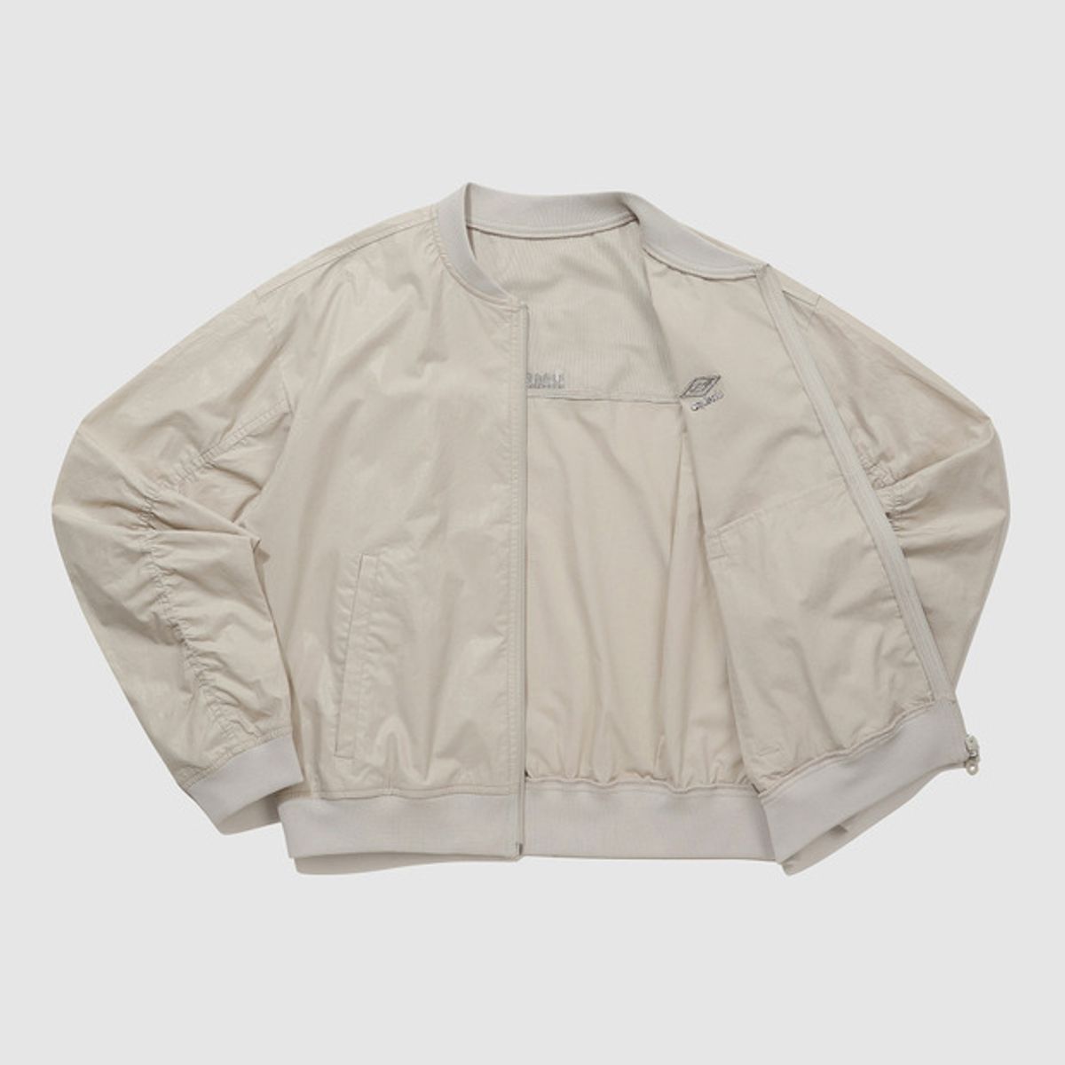 엄브로(UMBRO) 우먼스 코팅 봄버 자켓 베이지(UQ122CJK26)