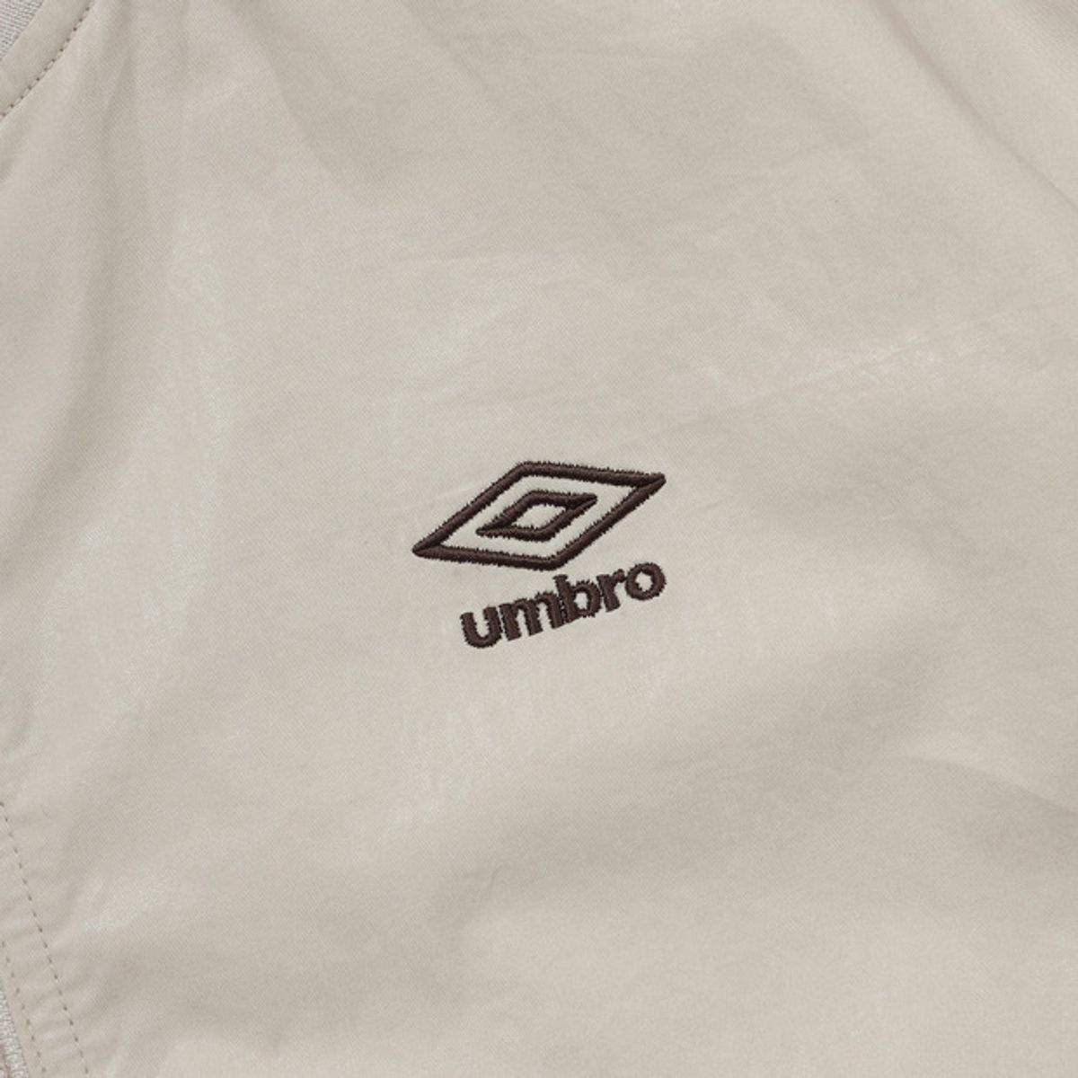 엄브로(UMBRO) 우먼스 코팅 봄버 자켓 베이지(UQ122CJK26)