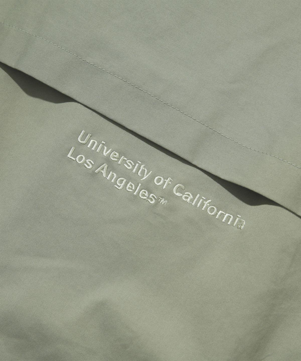 유씨엘에이(UCLA) 남녀공용 후디디태처블 MA-1 재킷[LT-KHAKI](UB1UJ80)