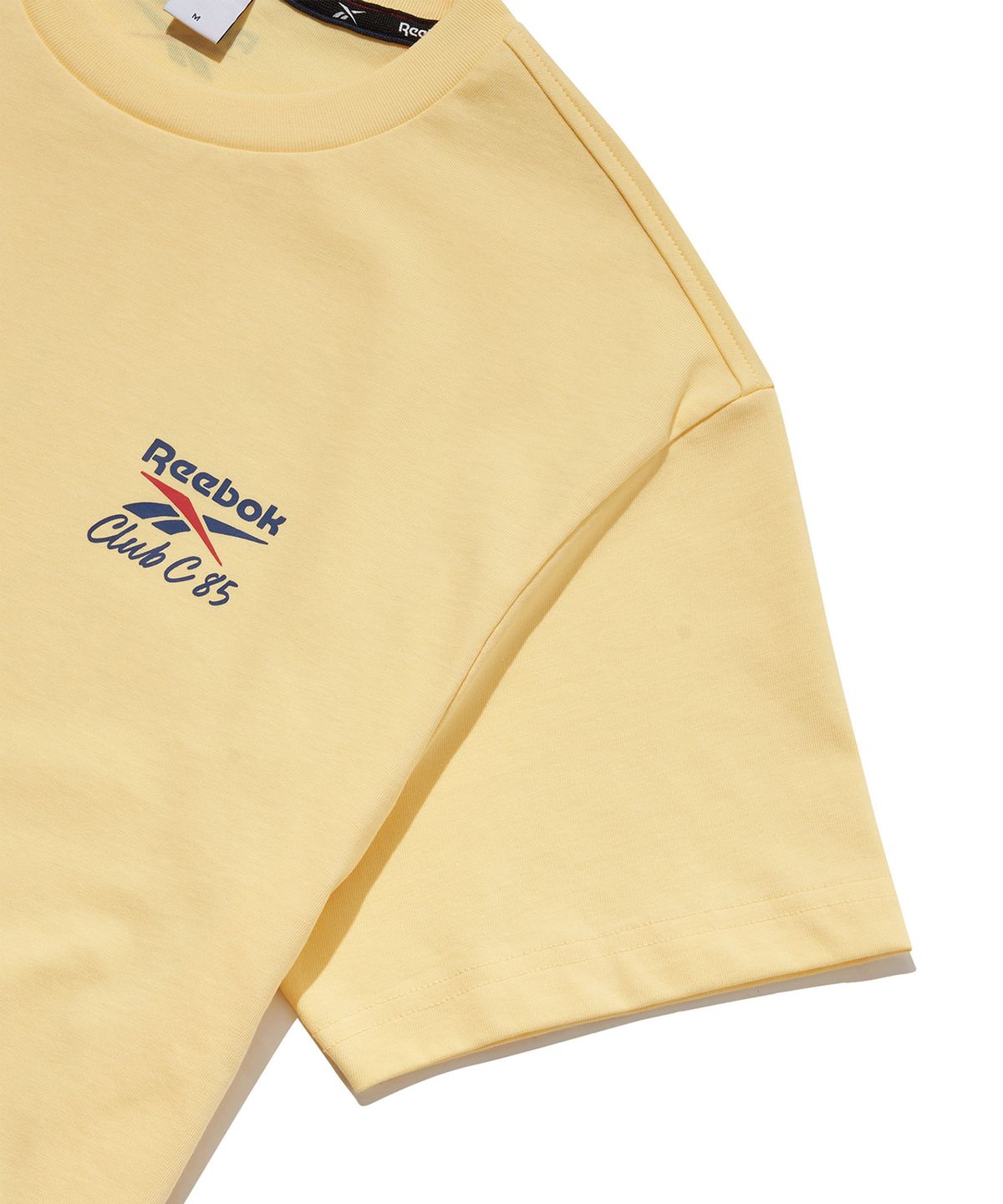리복(REEBOK) 클럽C 40주년 그래픽 티셔츠 - 버터