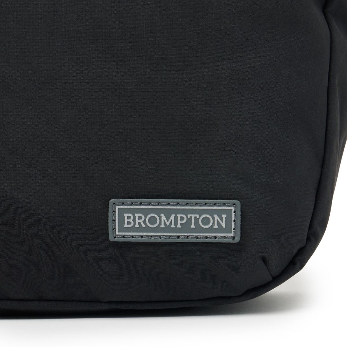 브롬톤 런던(BROMPTON LONDON) REPLECTIVE STRING CROSS BAG - BLACK (P255ACR101)