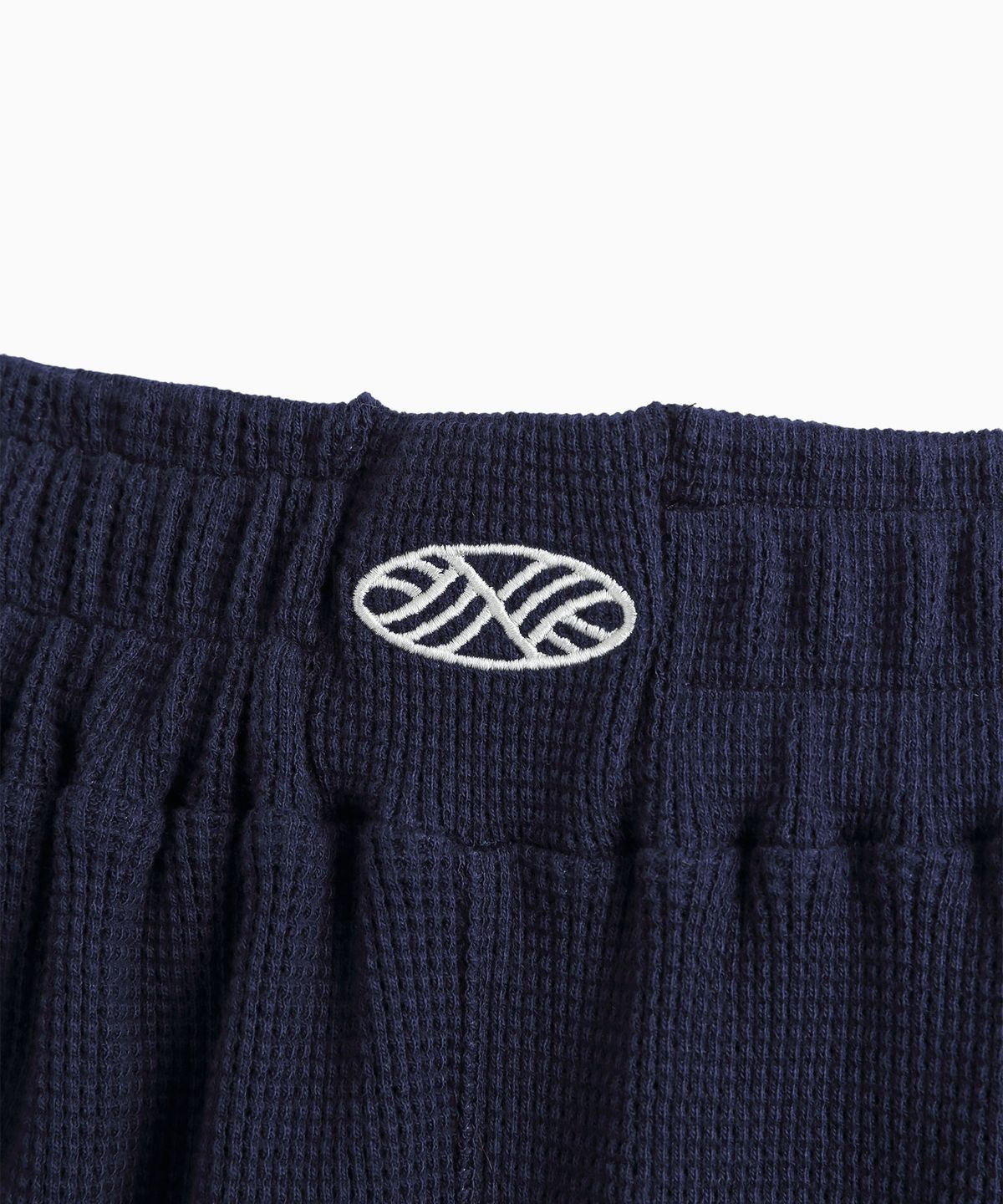 미나수(MENASOO) Track Logo Waffle Jogger Pants_Navy