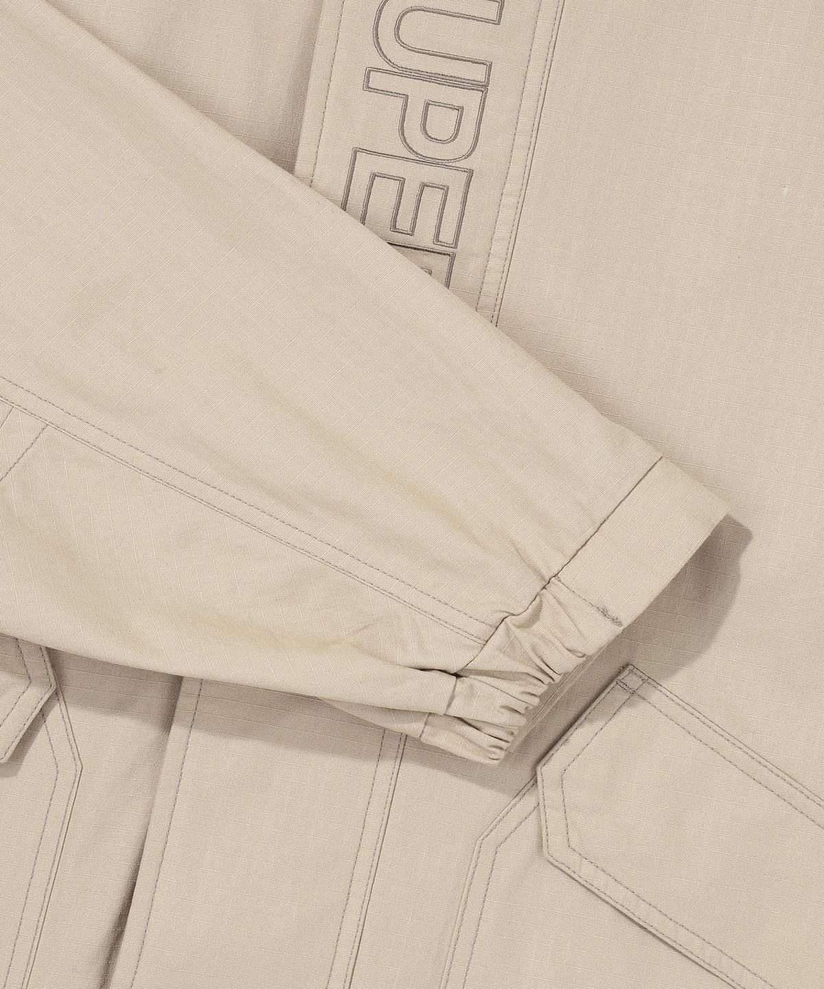 슈퍼드라이(SUPERDRY) 에센셜 윈드브레이커 자켓 베이지