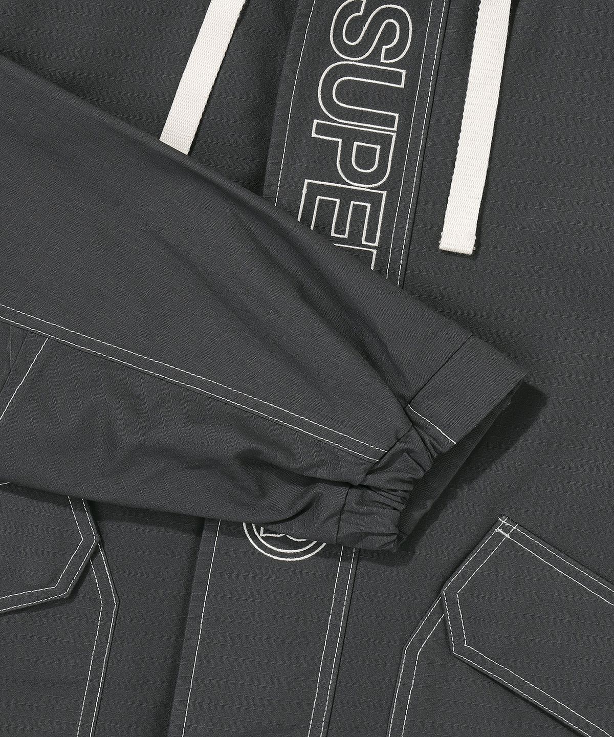 슈퍼드라이(SUPERDRY) 에센셜 윈드브레이커 자켓 베이지 챠콜