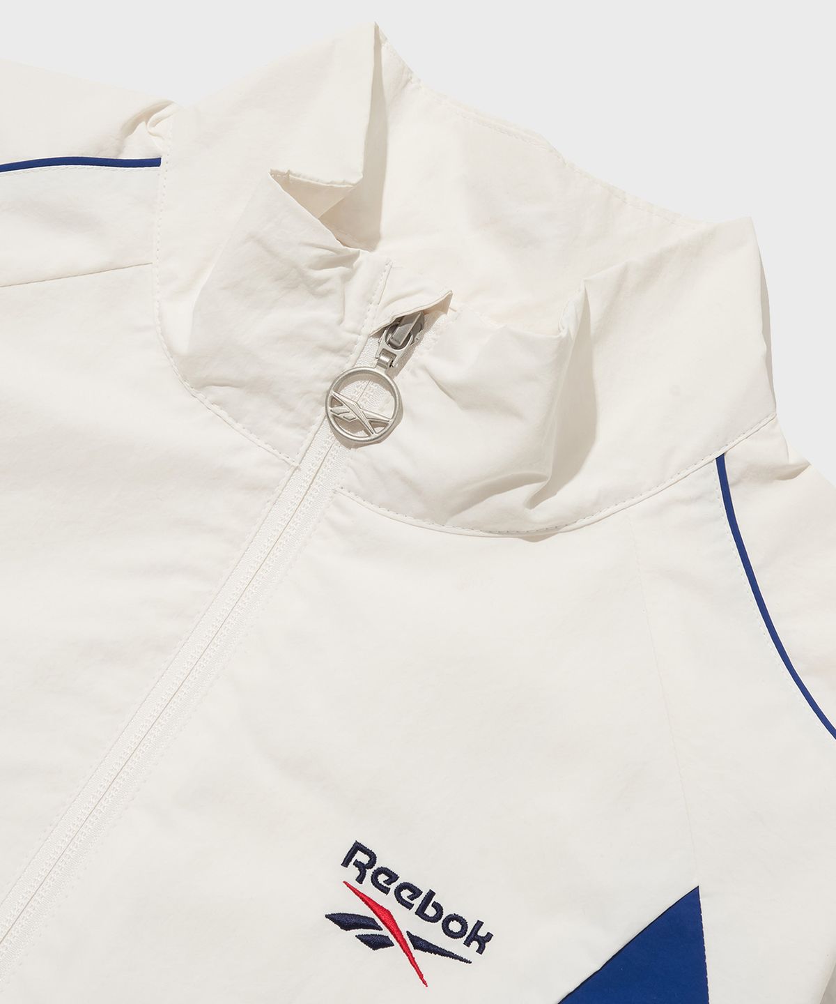 리복(REEBOK) 뉴베이직 크롭 윈드 브레이커 (W) - 화이트