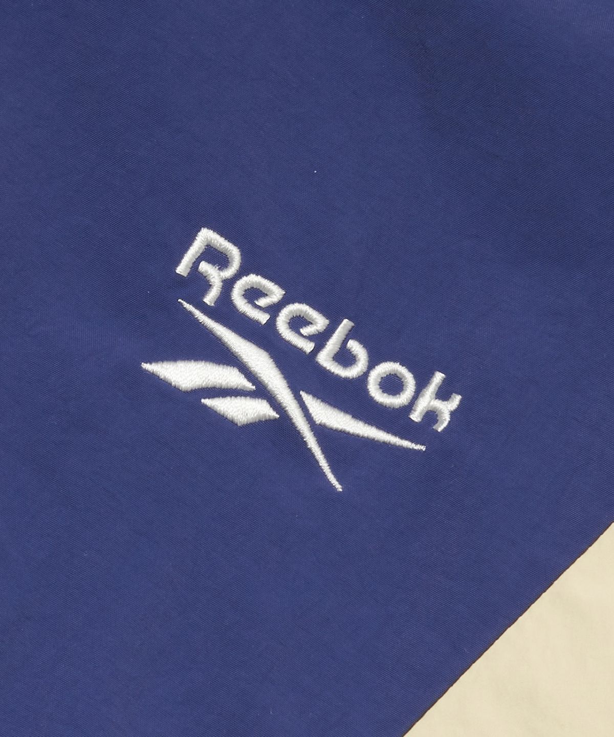 리복(REEBOK) 뉴베이직 크롭 윈드 브레이커 (W) - 더스트 블루