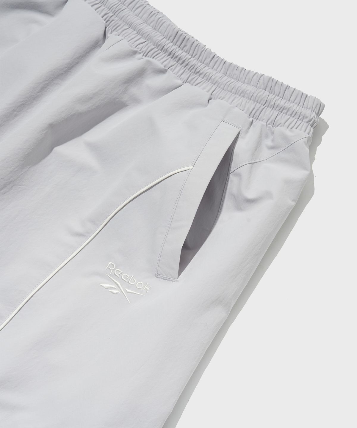리복(REEBOK) 파이핑 와이드 팬츠 (W) - 라이트 그레이