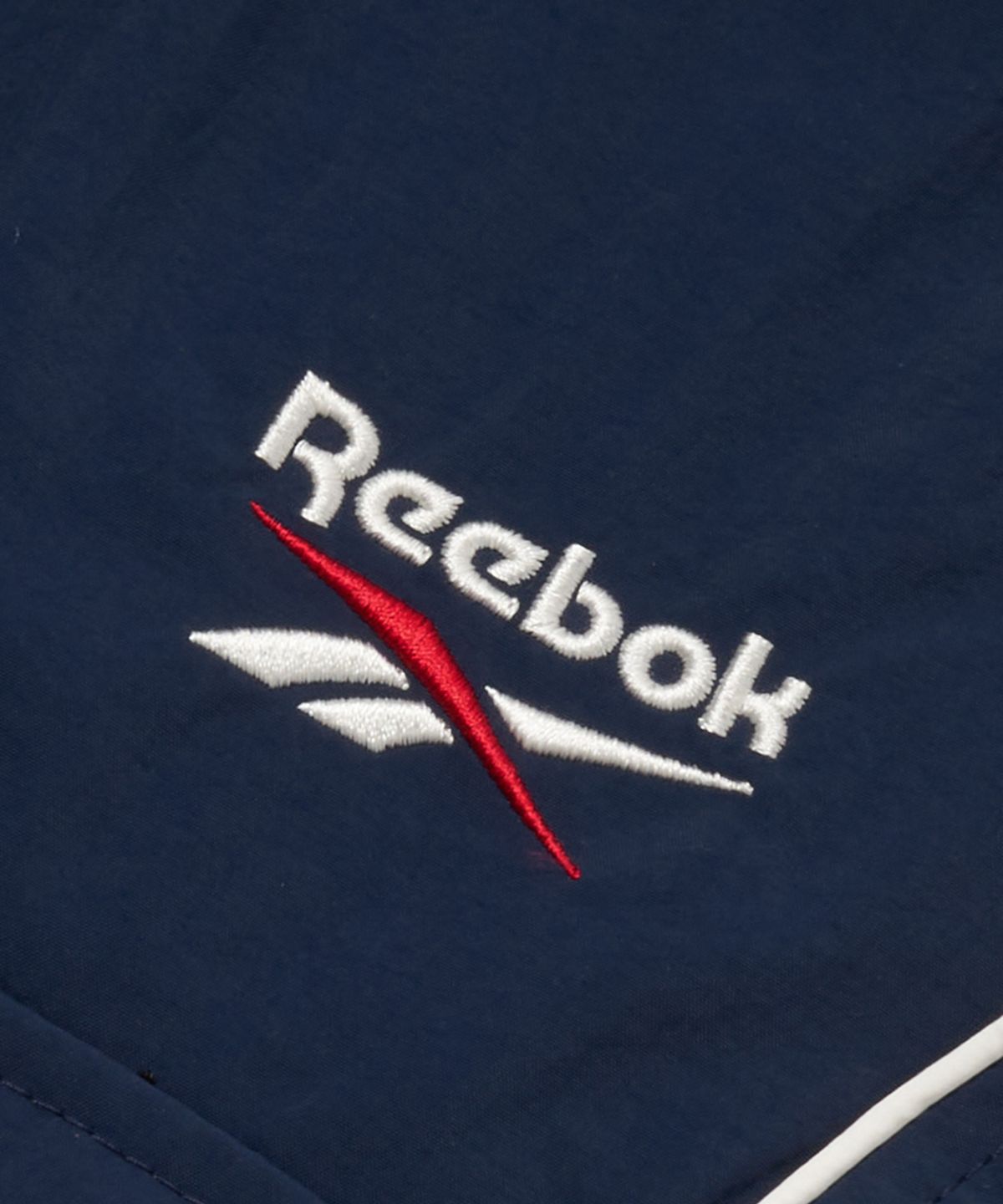 리복(REEBOK) 파이핑 우븐 스커트 (W) - 네이비