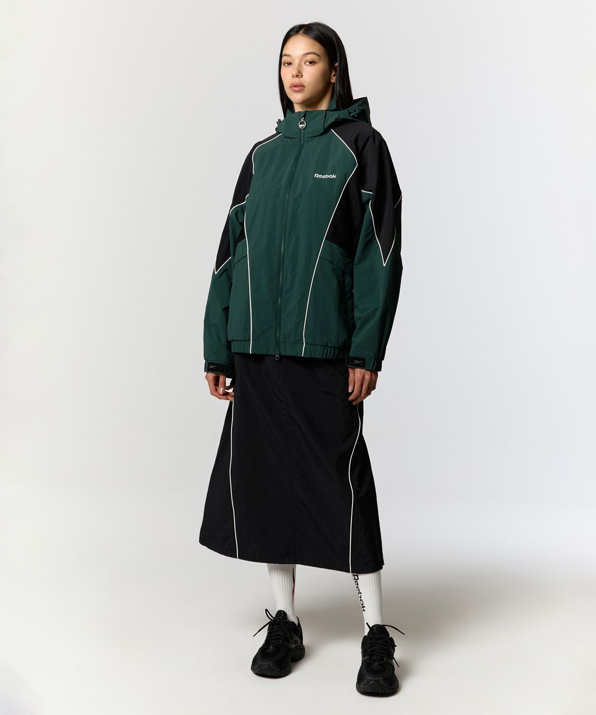 리복(REEBOK) 파이핑 우븐 스커트 (W) - 블랙