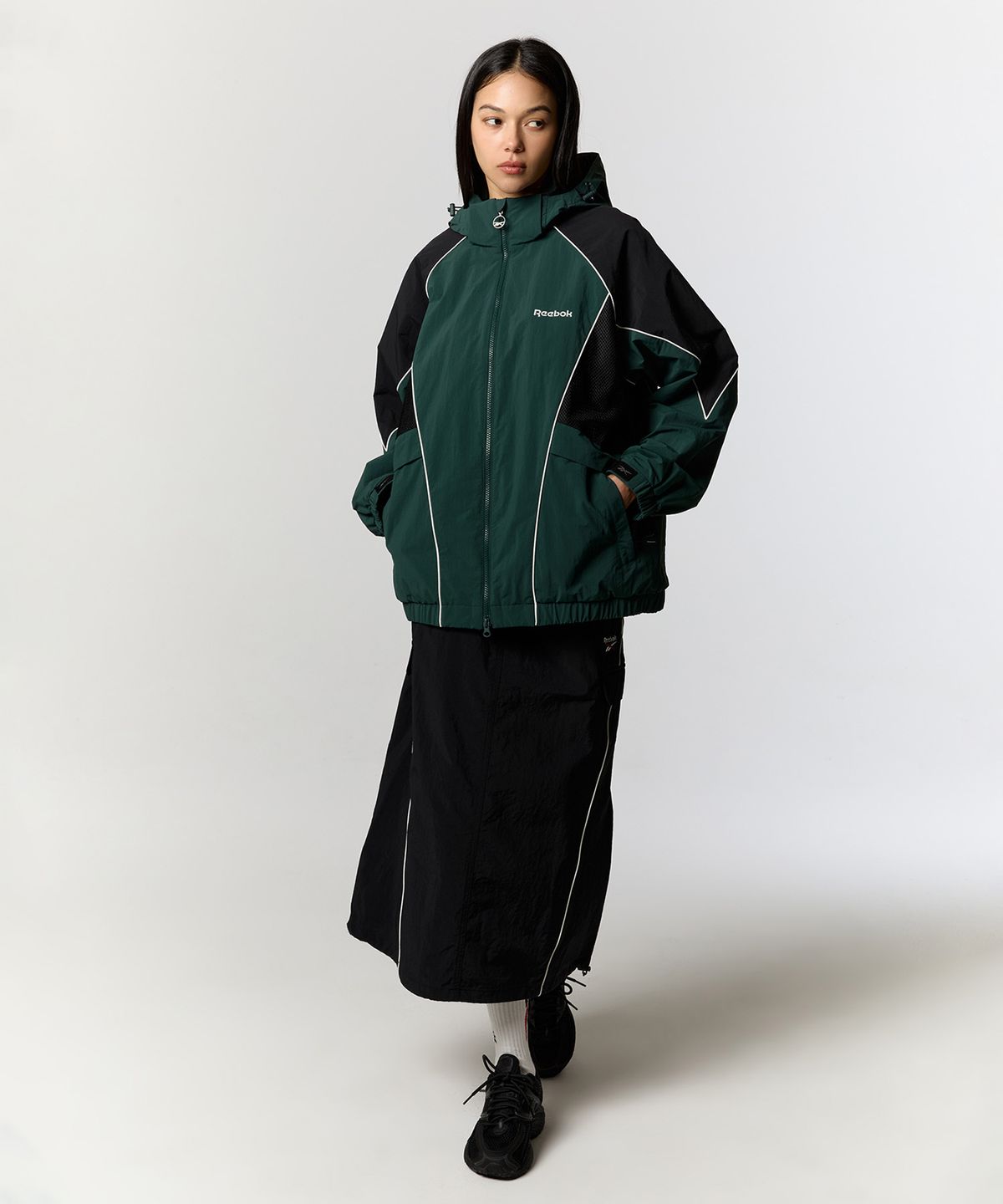 리복(REEBOK) 파이핑 우븐 스커트 (W) - 블랙