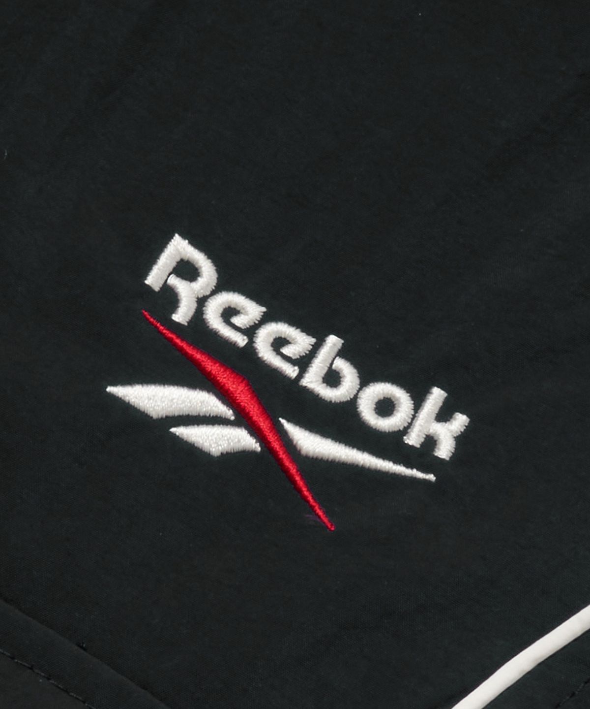 리복(REEBOK) 파이핑 우븐 스커트 (W) - 블랙