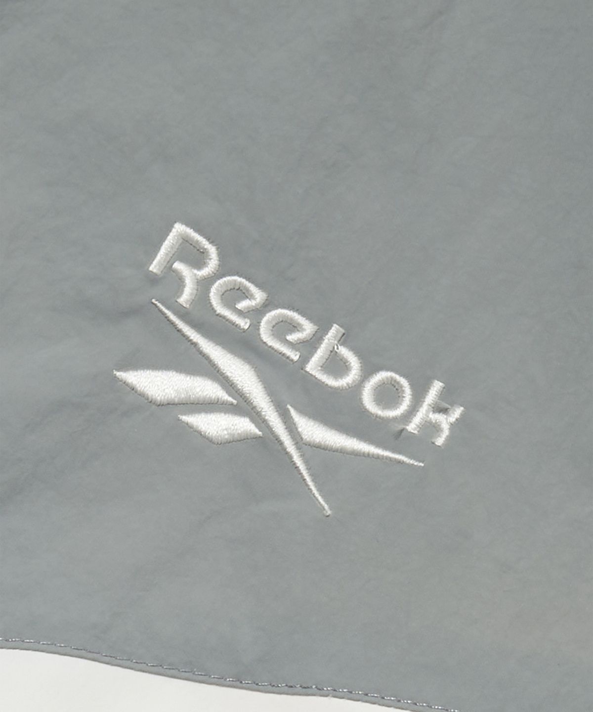 리복(REEBOK) 피스벡터 윈드 브레이커 - 라이트 그레이