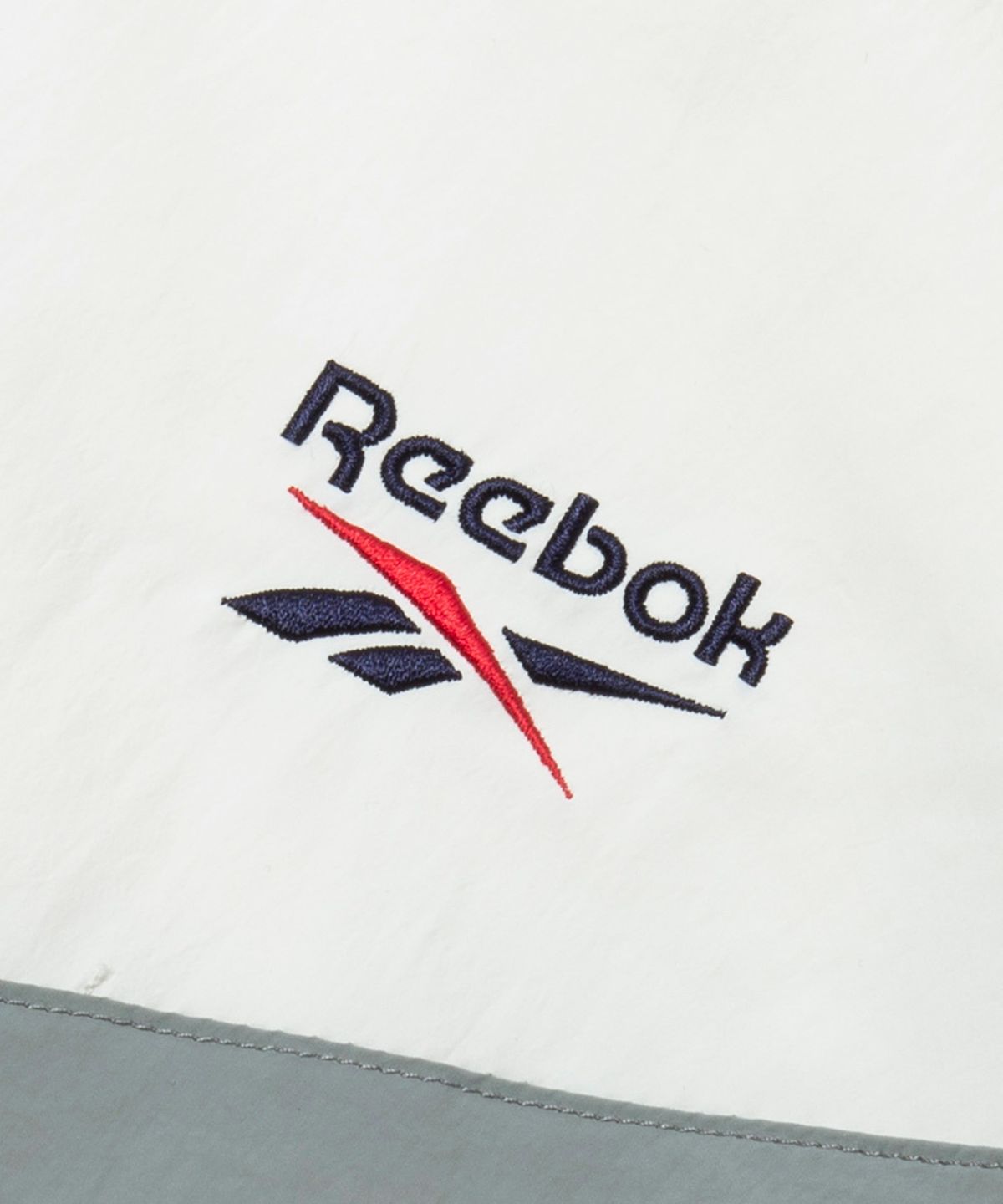 리복(REEBOK) 피스벡터 윈드 브레이커 - 화이트:네이비