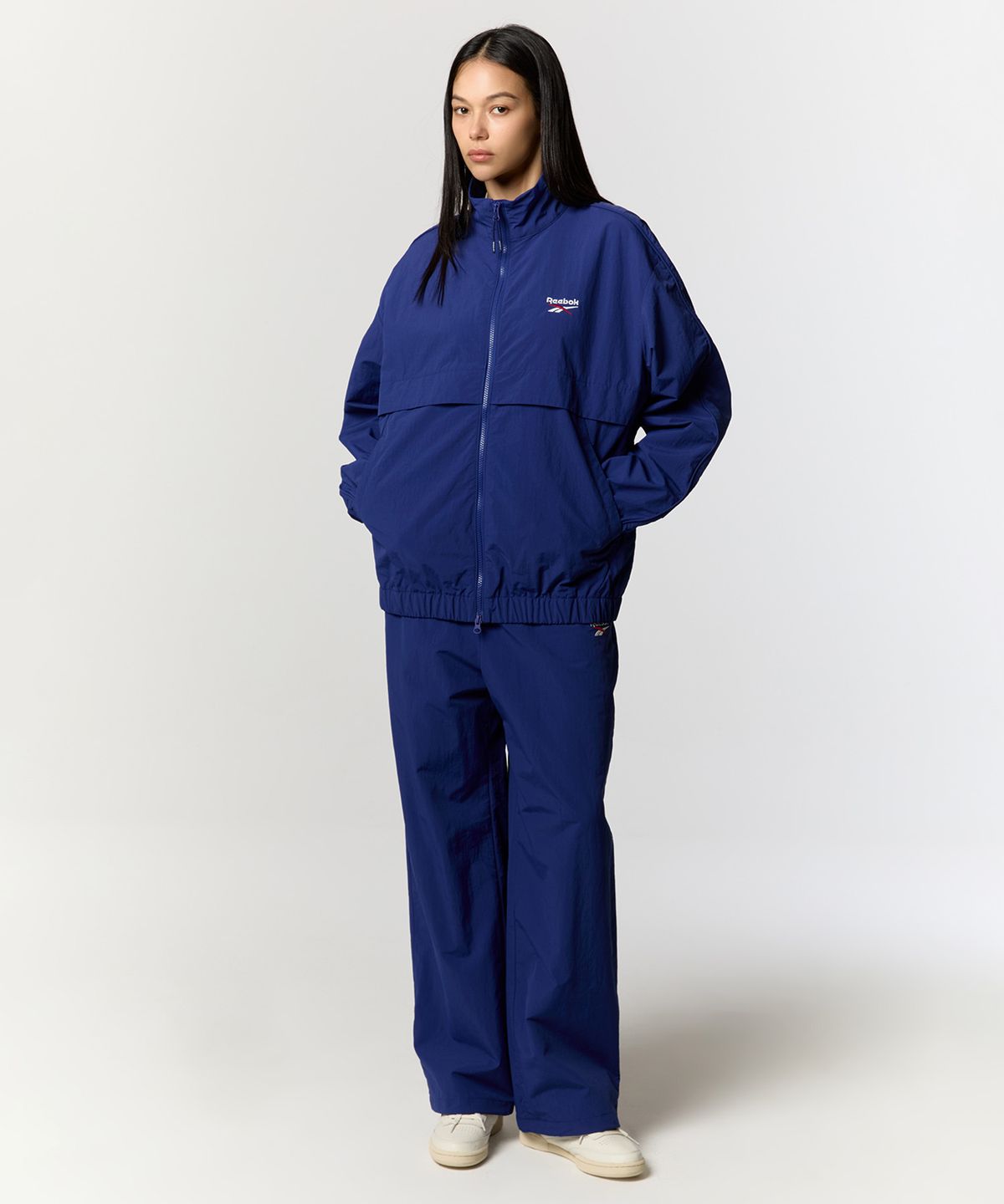 리복(REEBOK) 에센셜 웜업 윈드 브레이커 - 블루