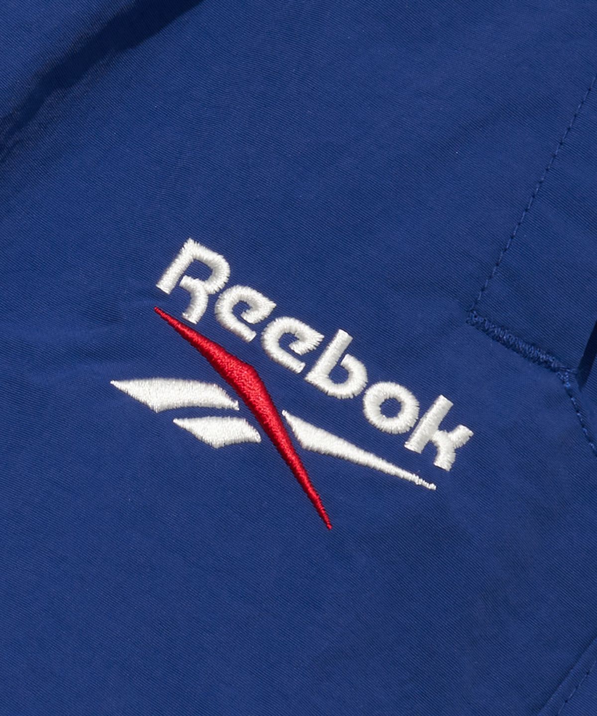 리복(REEBOK) 에센셜 2WAY 웜업 팬츠 - 블루