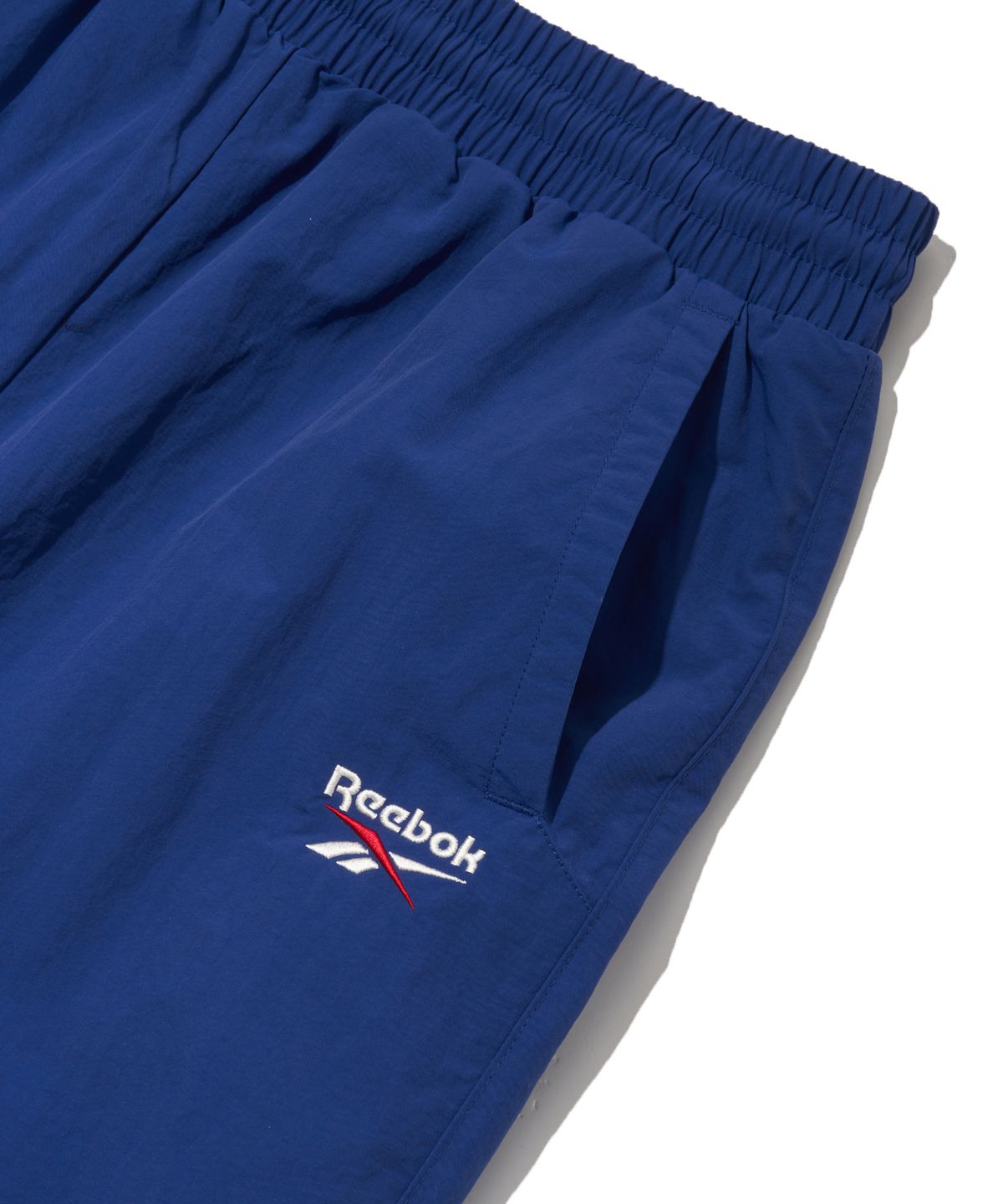 리복(REEBOK) 에센셜 2WAY 웜업 팬츠 - 블루