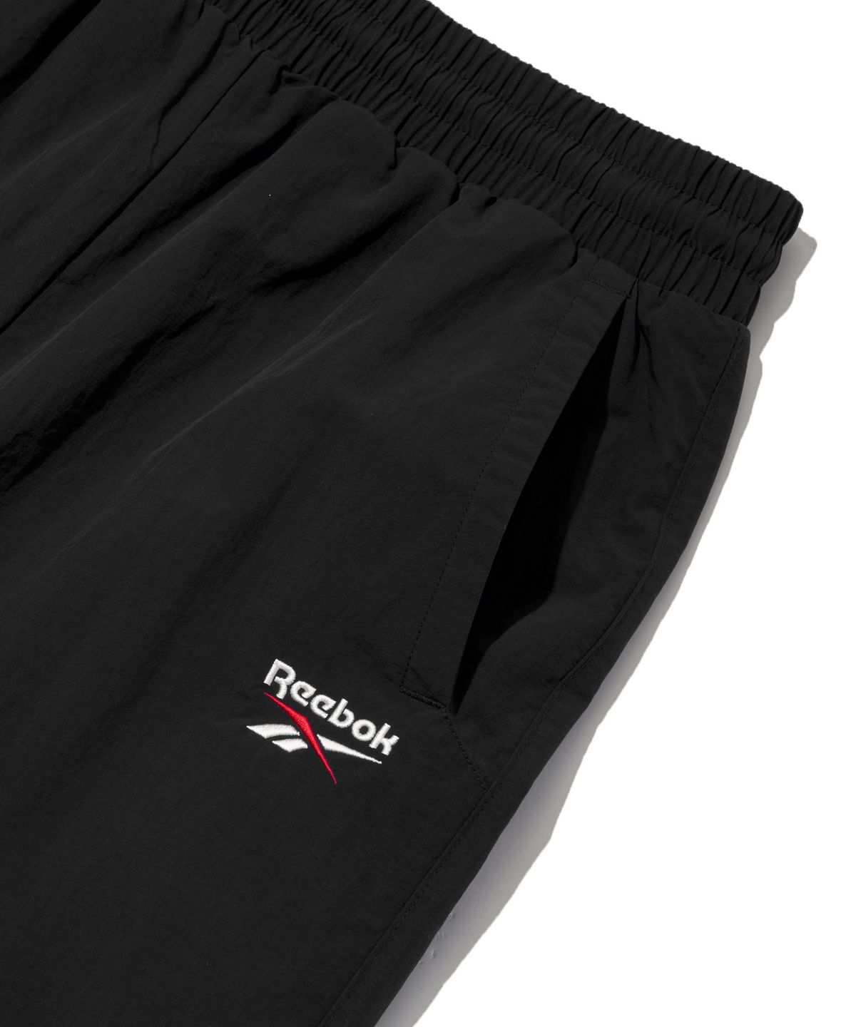리복(REEBOK) 에센셜 2WAY 웜업 팬츠 - 블랙