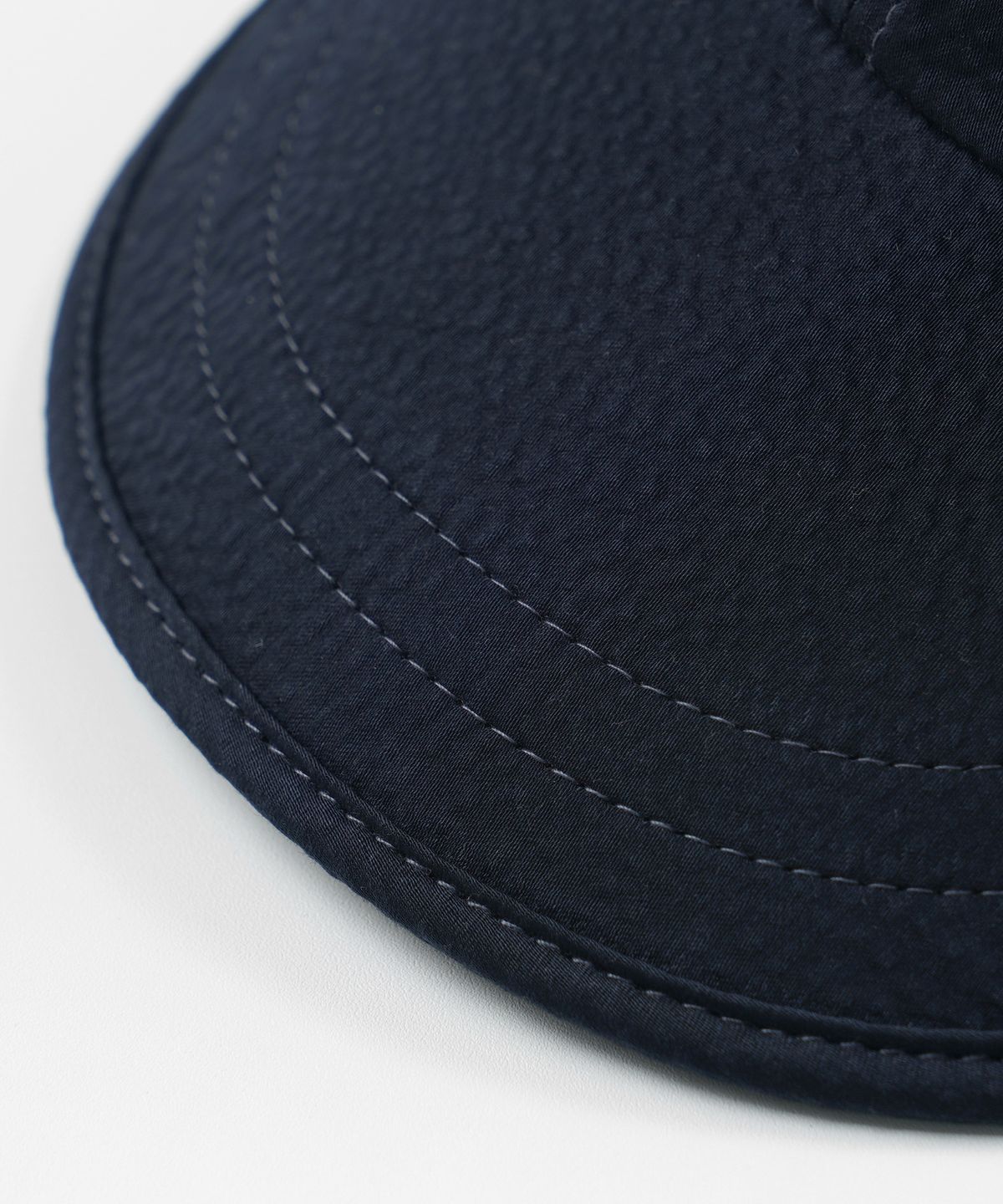 프리즘웍스(FRIZMWORKS) SEERSUCKER FEATHER CAP _ NAVY