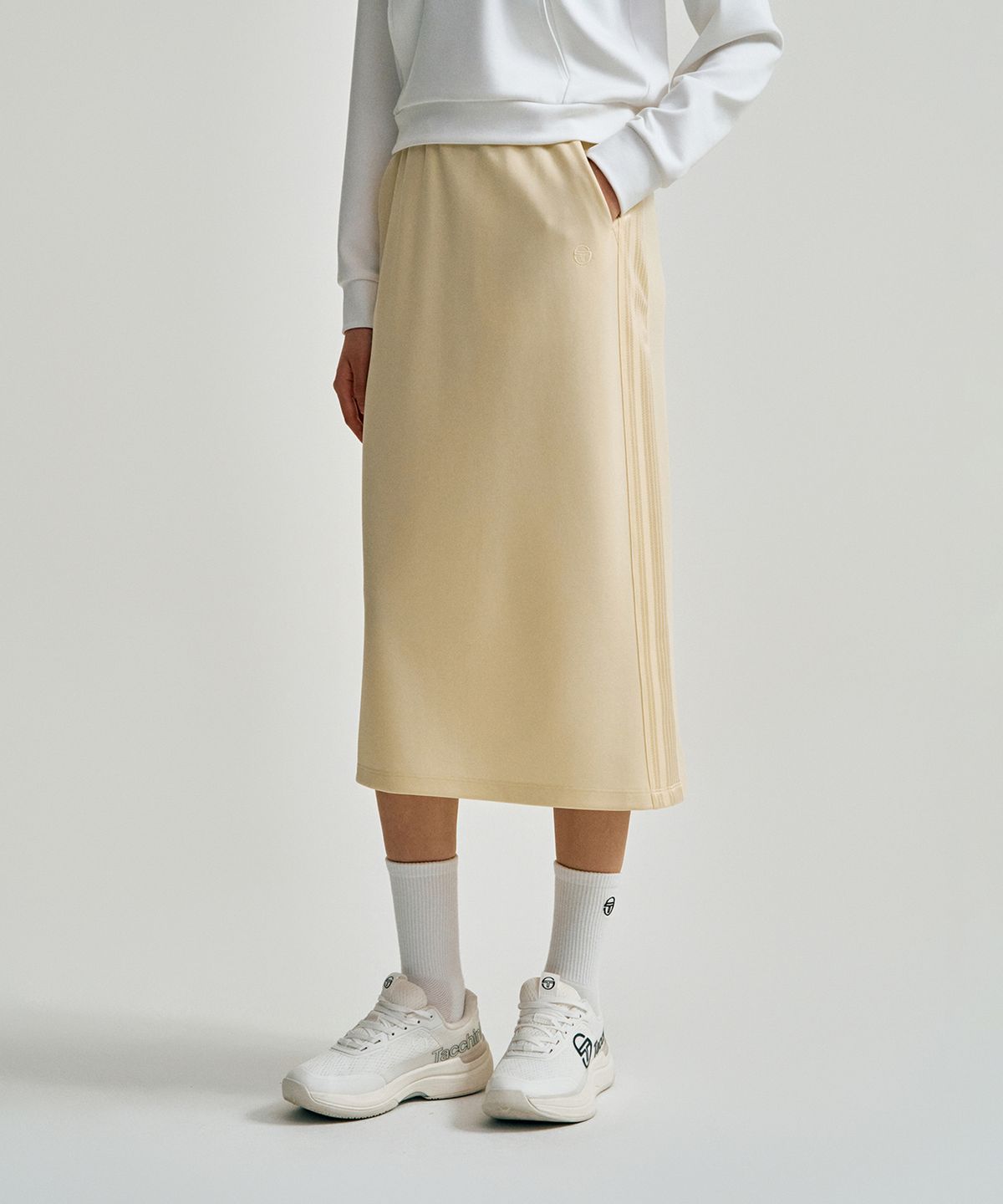 세르지오 타키니(SERGIO TACCHINI) W 타키니 모던 트랙 미디 스커트 (L.Yellow)