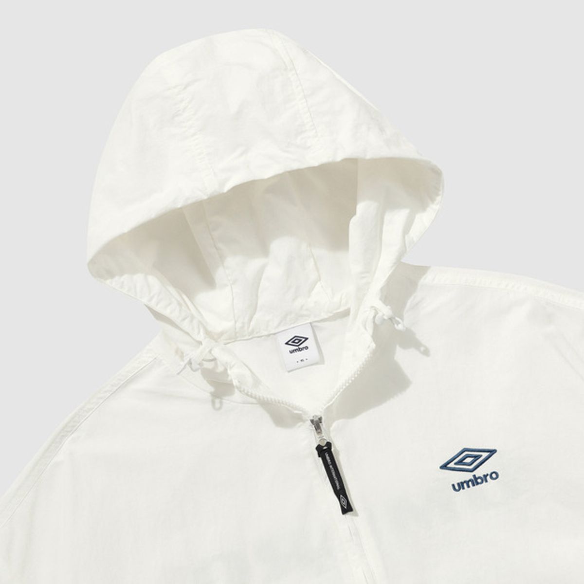 엄브로(UMBRO) 클래식 긴팔 후드형 아노락 아이보리(UQ221CWT41)