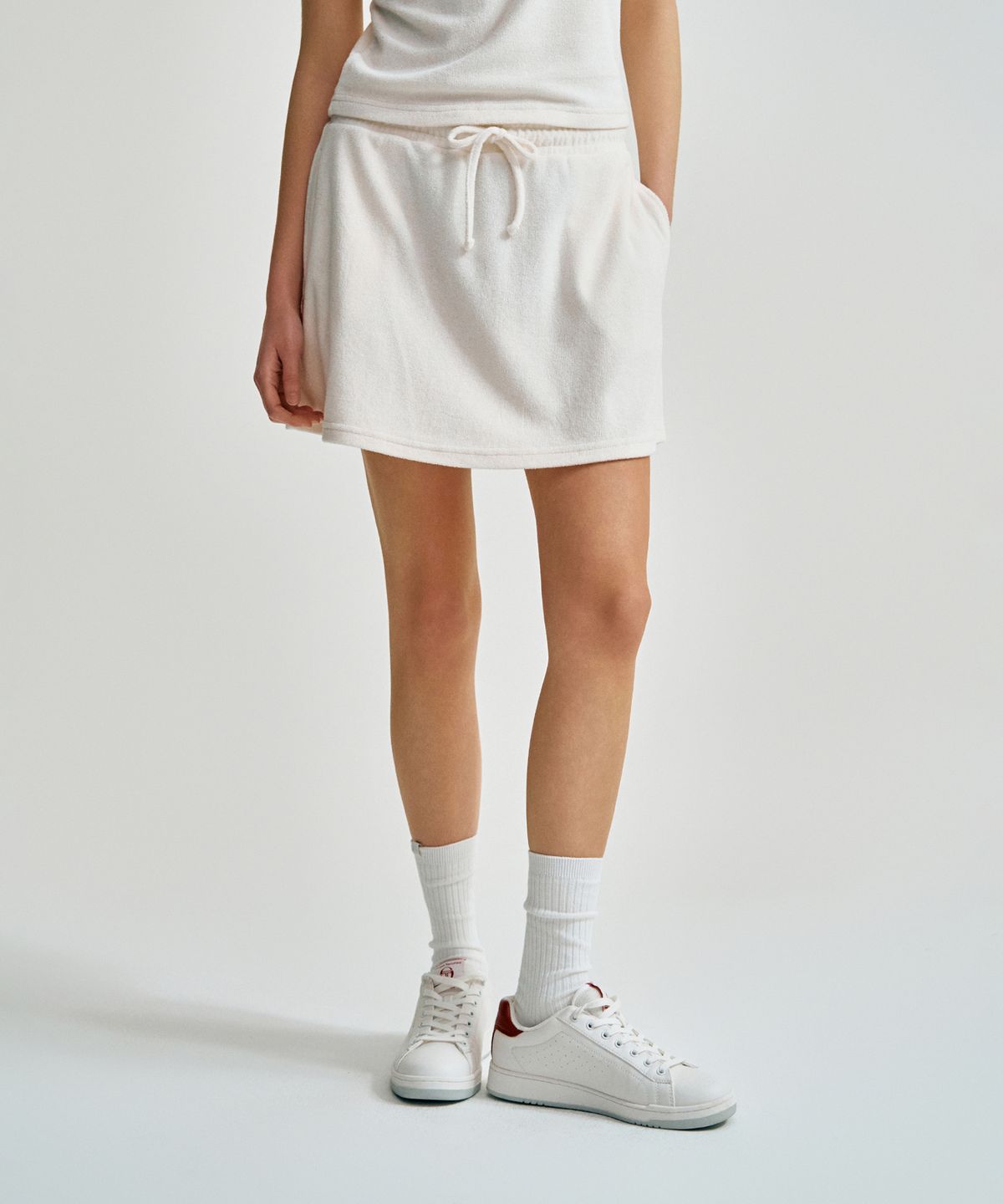 세르지오 타키니(SERGIO TACCHINI) W 에다 테리 플레어 스커트 (Ivory)