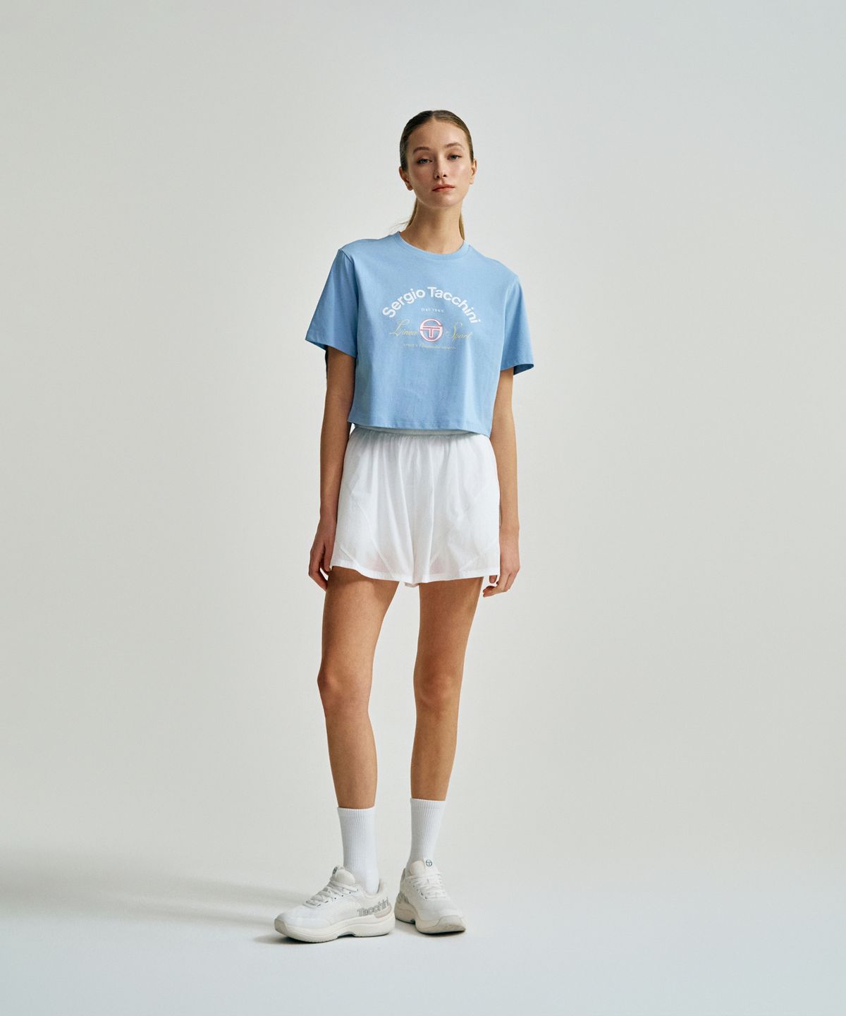 세르지오 타키니(SERGIO TACCHINI) W 쿨매치 아트웍 크롭 반팔 티셔츠 (L.Indigo)