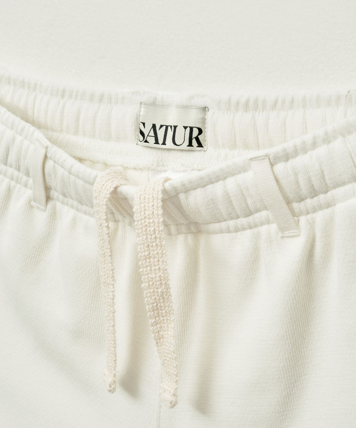 세터(SATUR) (W) 로턴 올 데이 트랙 쇼츠 화이트