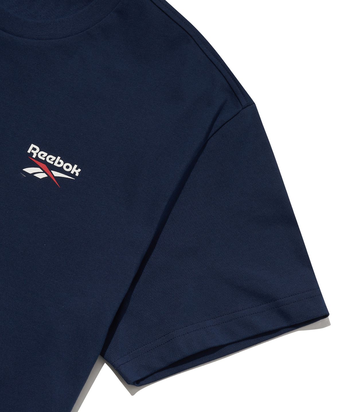 리복(REEBOK) 빅벡터 슬로건 티셔츠 - 네이비