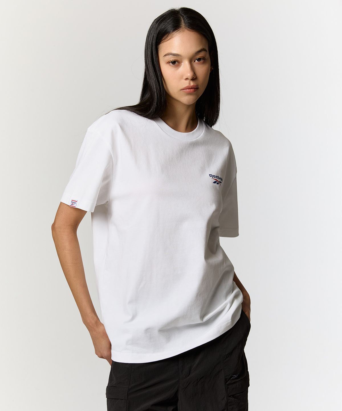리복(REEBOK) 빅벡터 슬로건 티셔츠 - 화이트