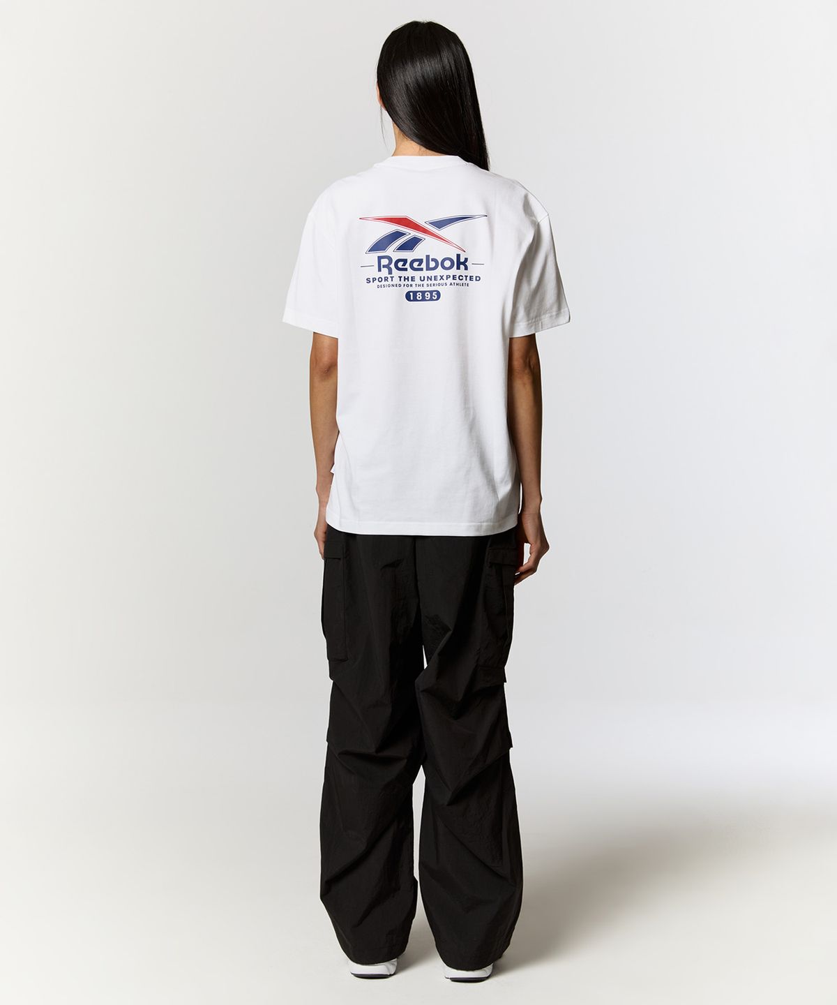 리복(REEBOK) 빅벡터 슬로건 티셔츠 - 화이트