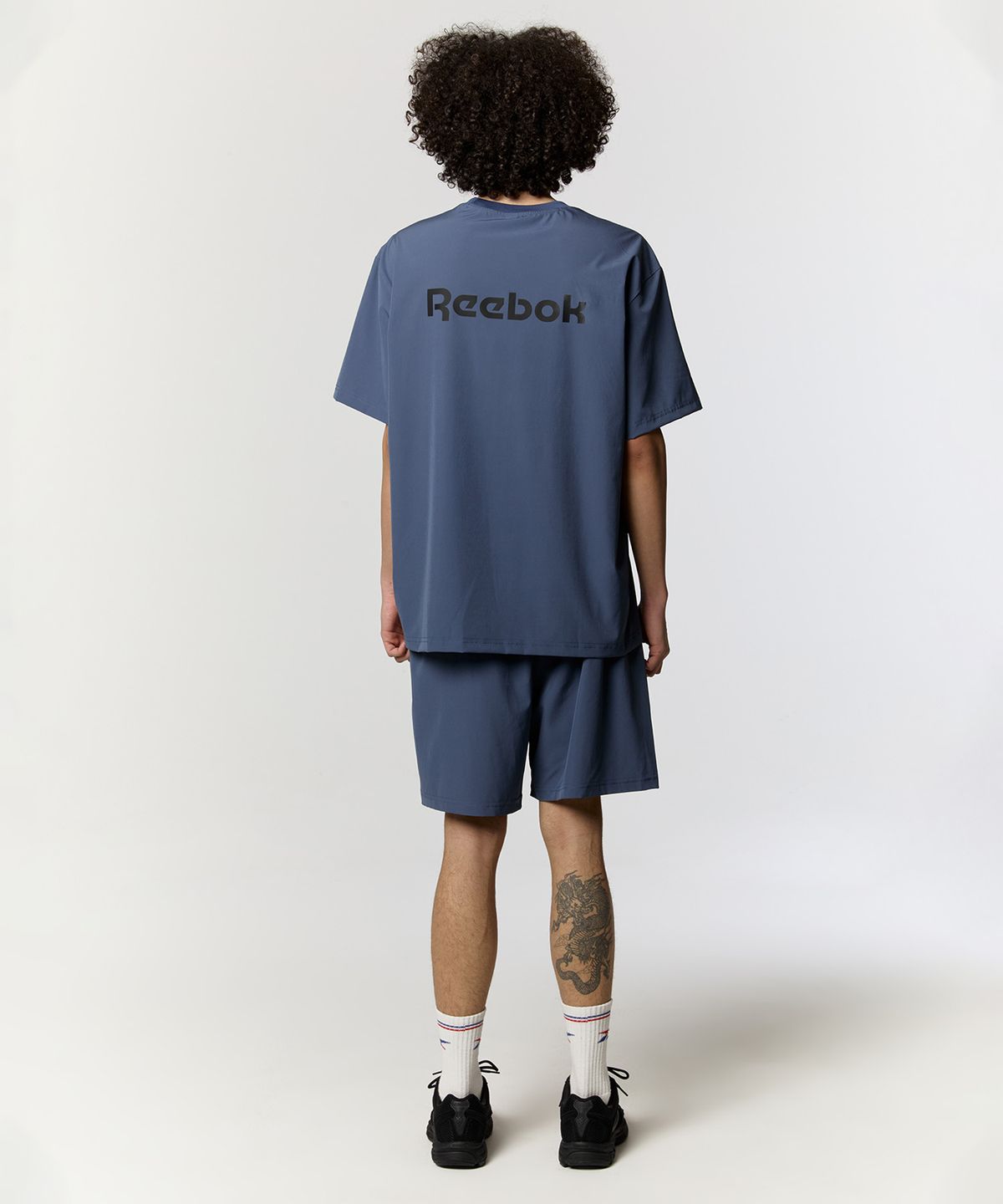 리복(REEBOK) 리커버리 우븐 셋업 - 블루
