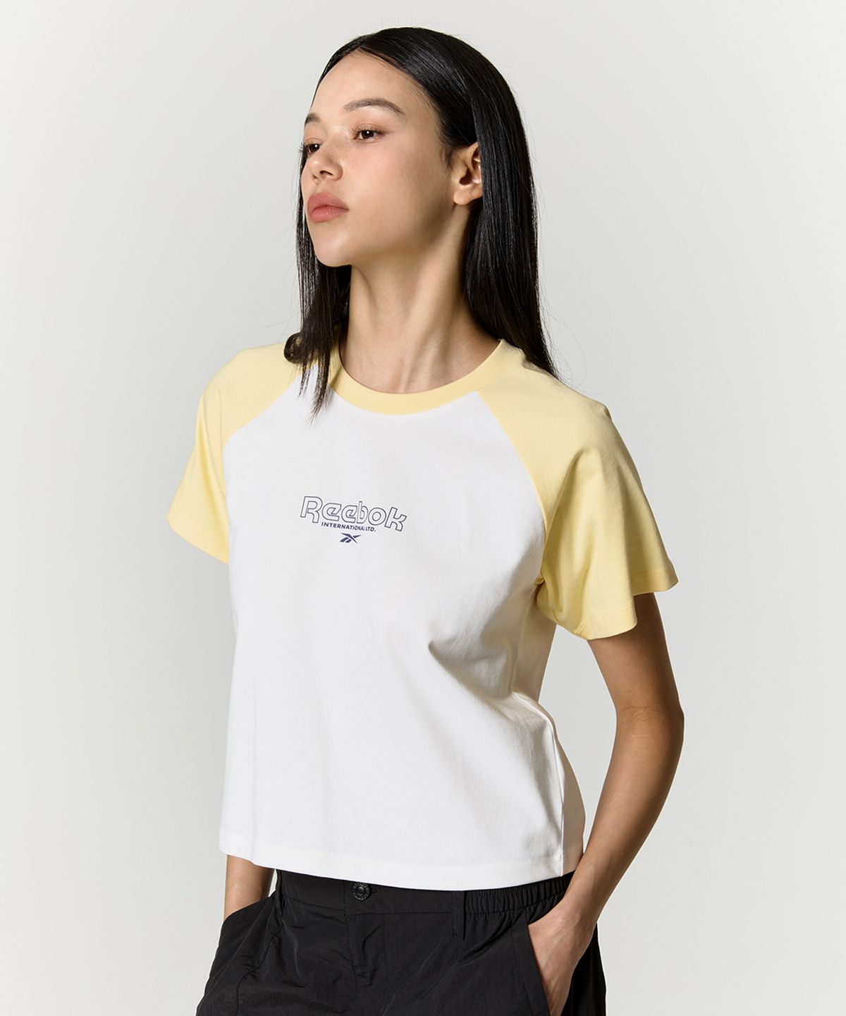 리복(REEBOK) 프린트 래글런 티셔츠 (W) - 버터