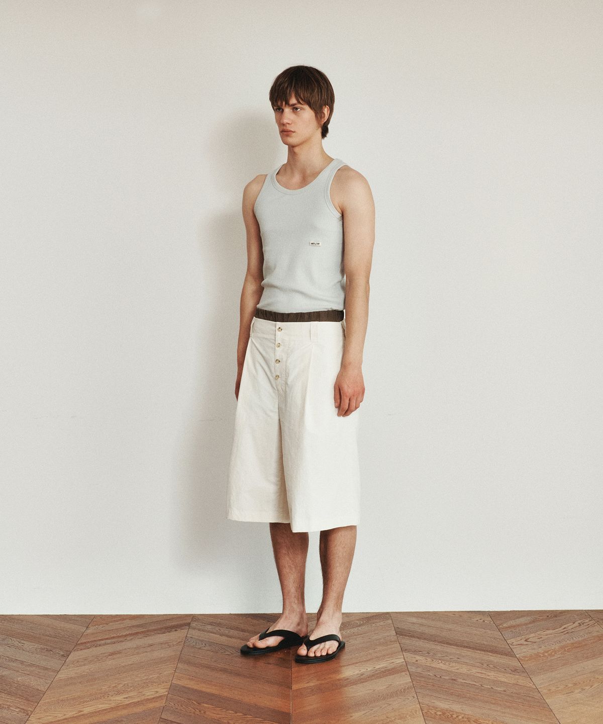 호이테(HEUTE) HET RIBBED SLIM SLEVELESS TOP (LIGHT GREY)