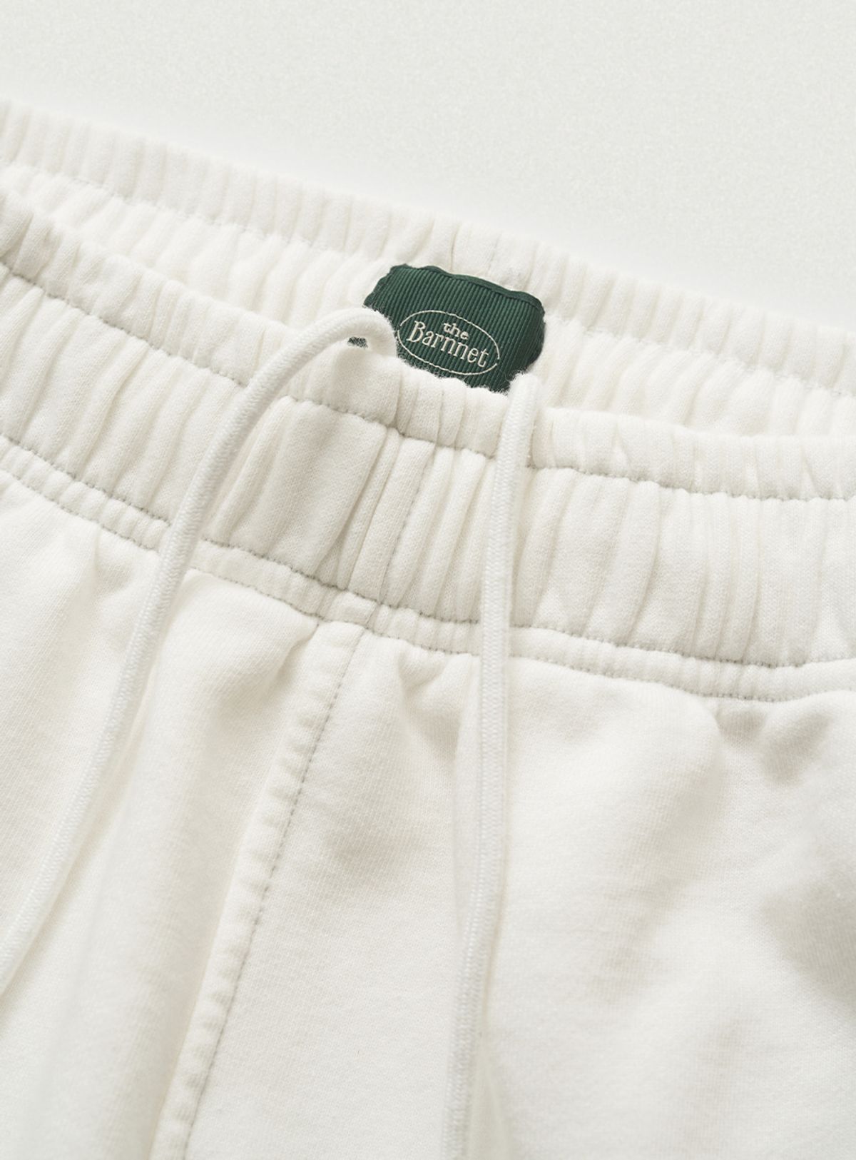 더바넷(THEBARNNET) Campie Sweat Drawstring Jogger Pants_Ivory