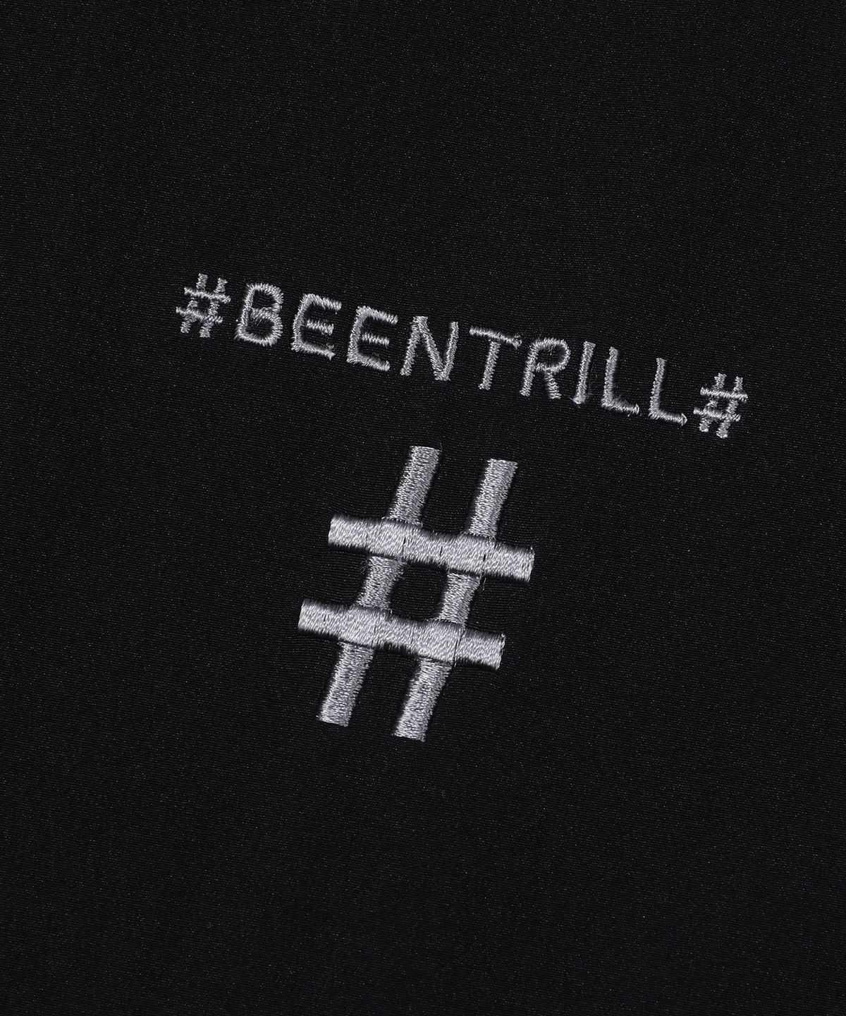 빈트릴(BEENTRILL) 스프레이 로고 우븐 점퍼(블랙)