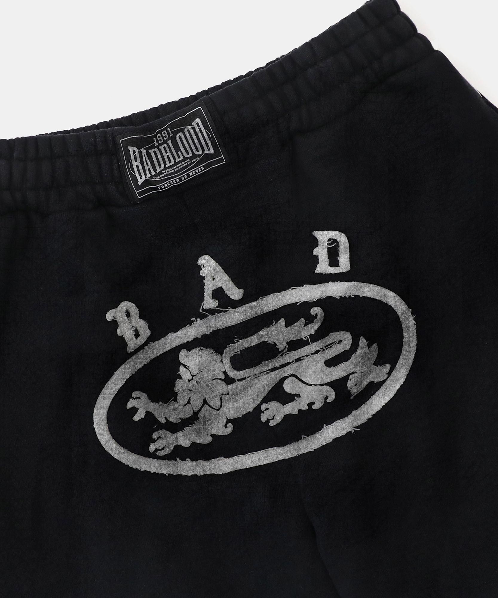 【BADBLOOD】Lion Patch 2 Way Curved Jogger - Washed Black MUSINSA | BADBLOOD Lion Patch 2 Way Curved Jogger - Washed Black