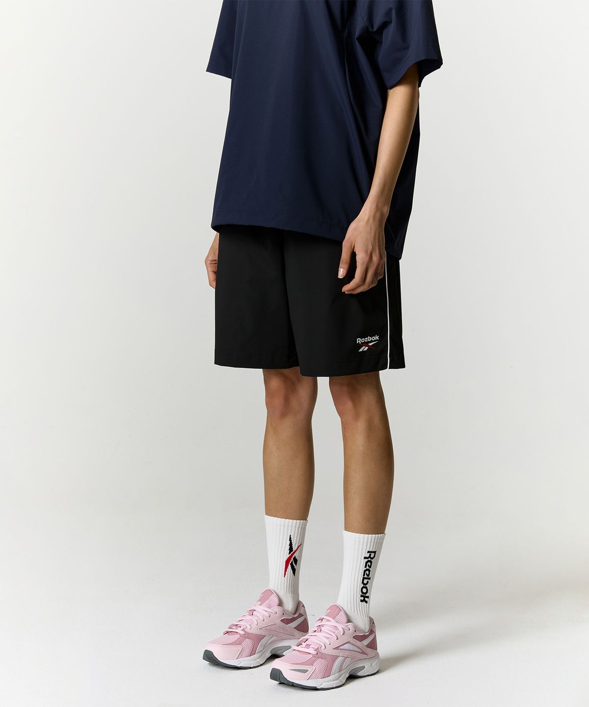 리복(REEBOK) 리바이벌 스트레치 쇼츠 - 블랙