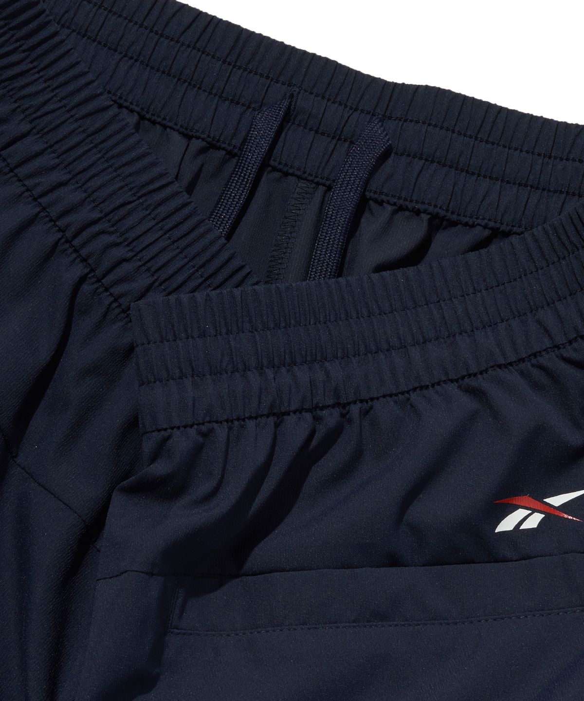리복(REEBOK) 리바이벌 스트레치 쇼츠 - 네이비
