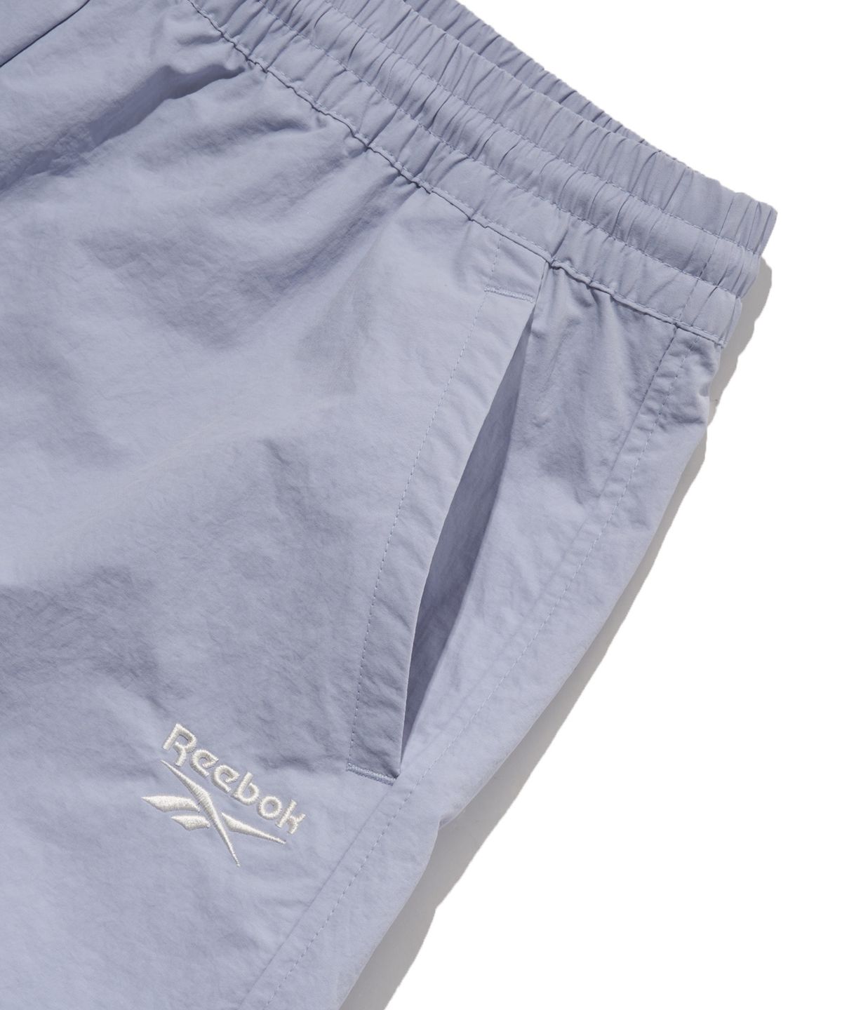 리복(REEBOK) 에센셜 우븐 쇼츠  (W) - 라벤더