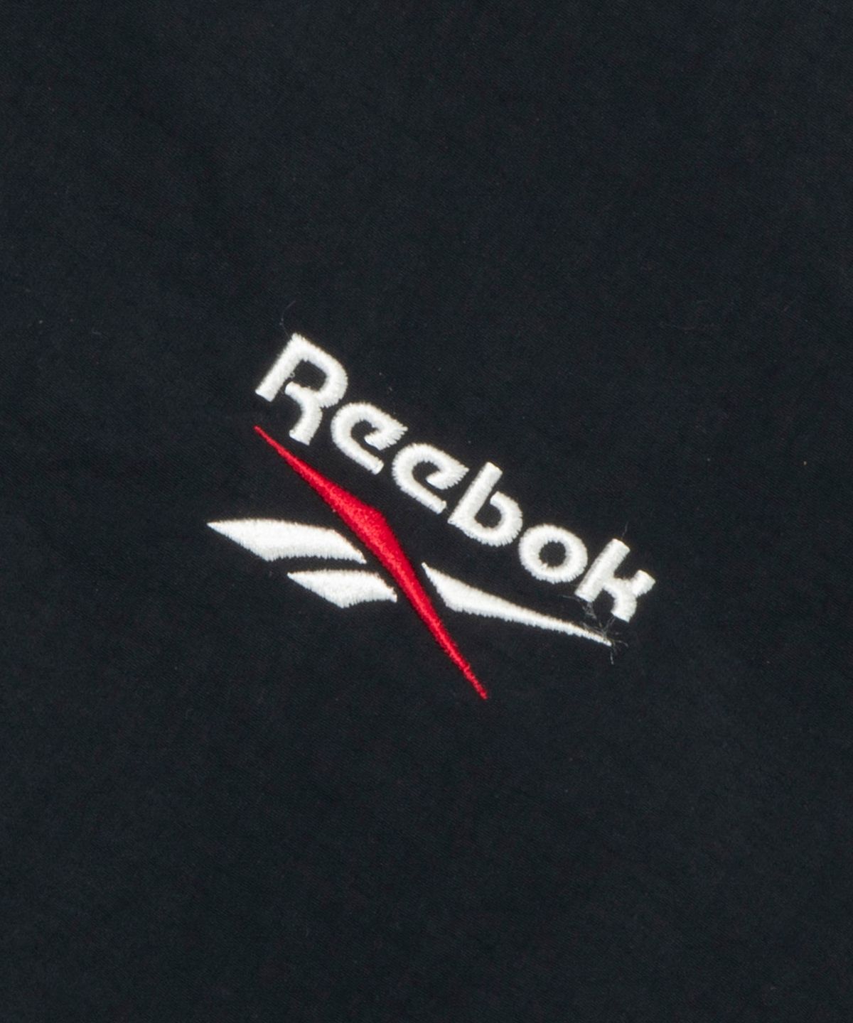 리복(REEBOK) 에센셜 반팔 아노락 - 블랙