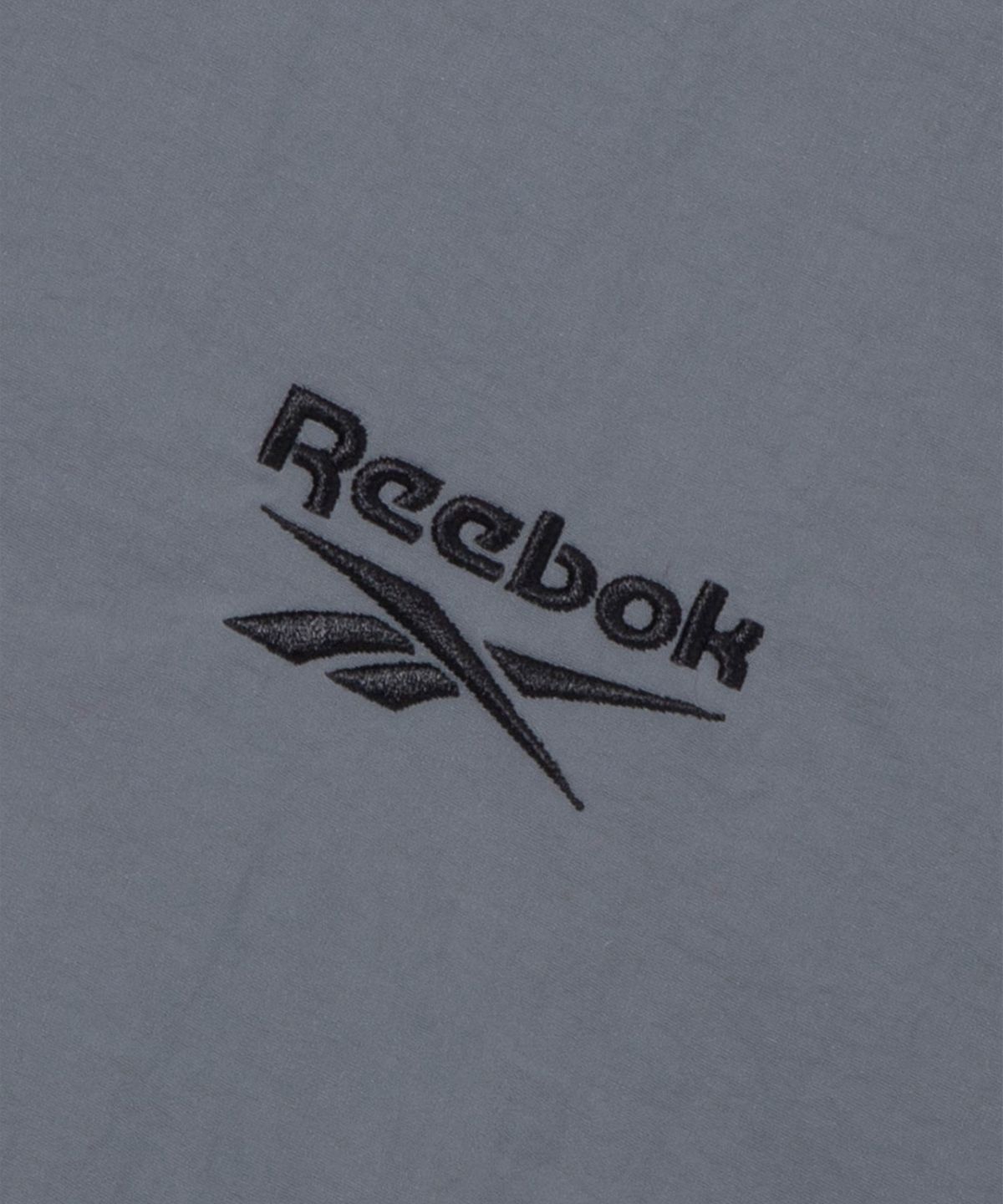 리복(REEBOK) 에센셜 반팔 아노락 - 차콜