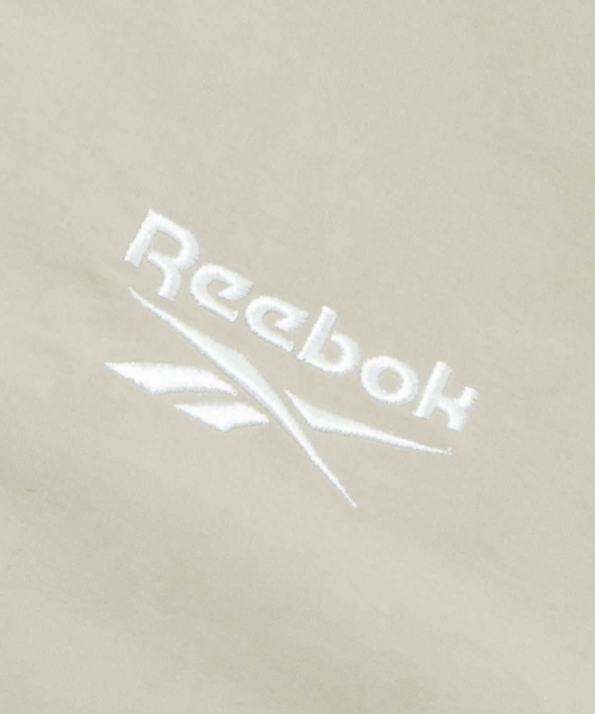 리복(REEBOK) 에센셜 반팔 아노락 - 베이지