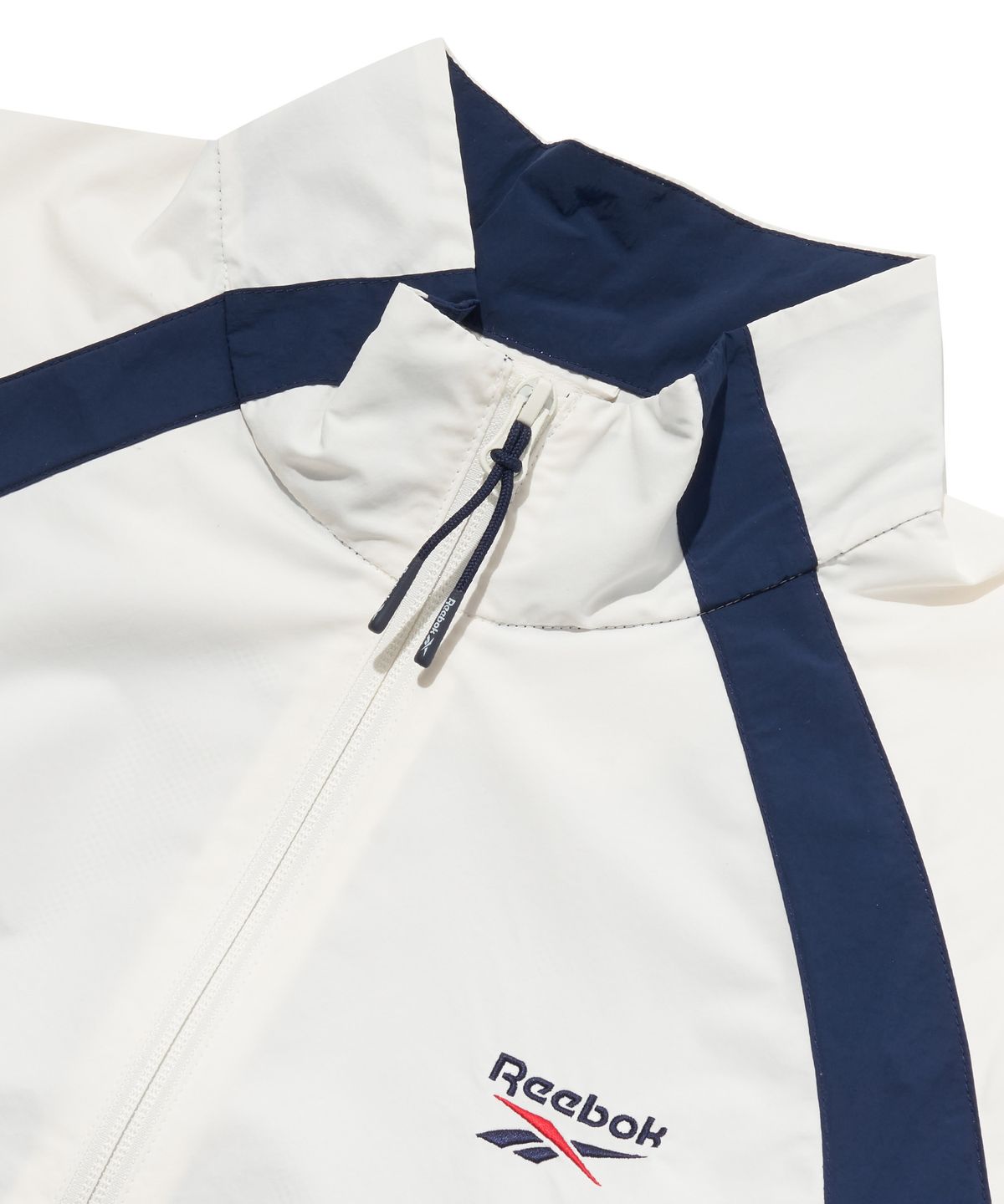 리복(REEBOK) 일립스 크롭 윈드 브레이커 (W) - 화이트:네이비